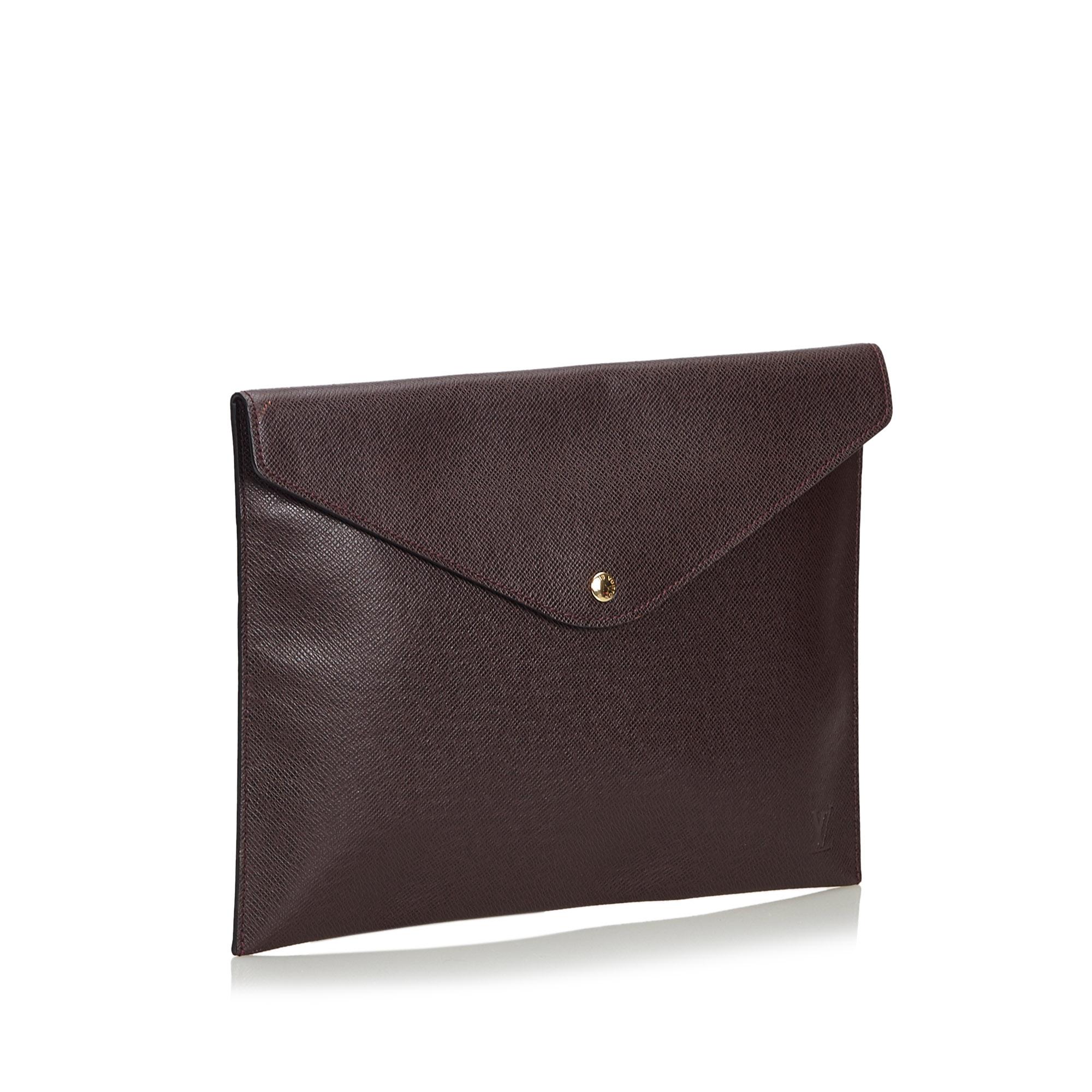 This Document Case Clutch Bag features a taiga leather body and front flap with button clasp closure. It carries as B+ condition rating.

Inclusions: 
This item does not come with inclusions.


Louis Vuitton pieces do not come with an authenticity