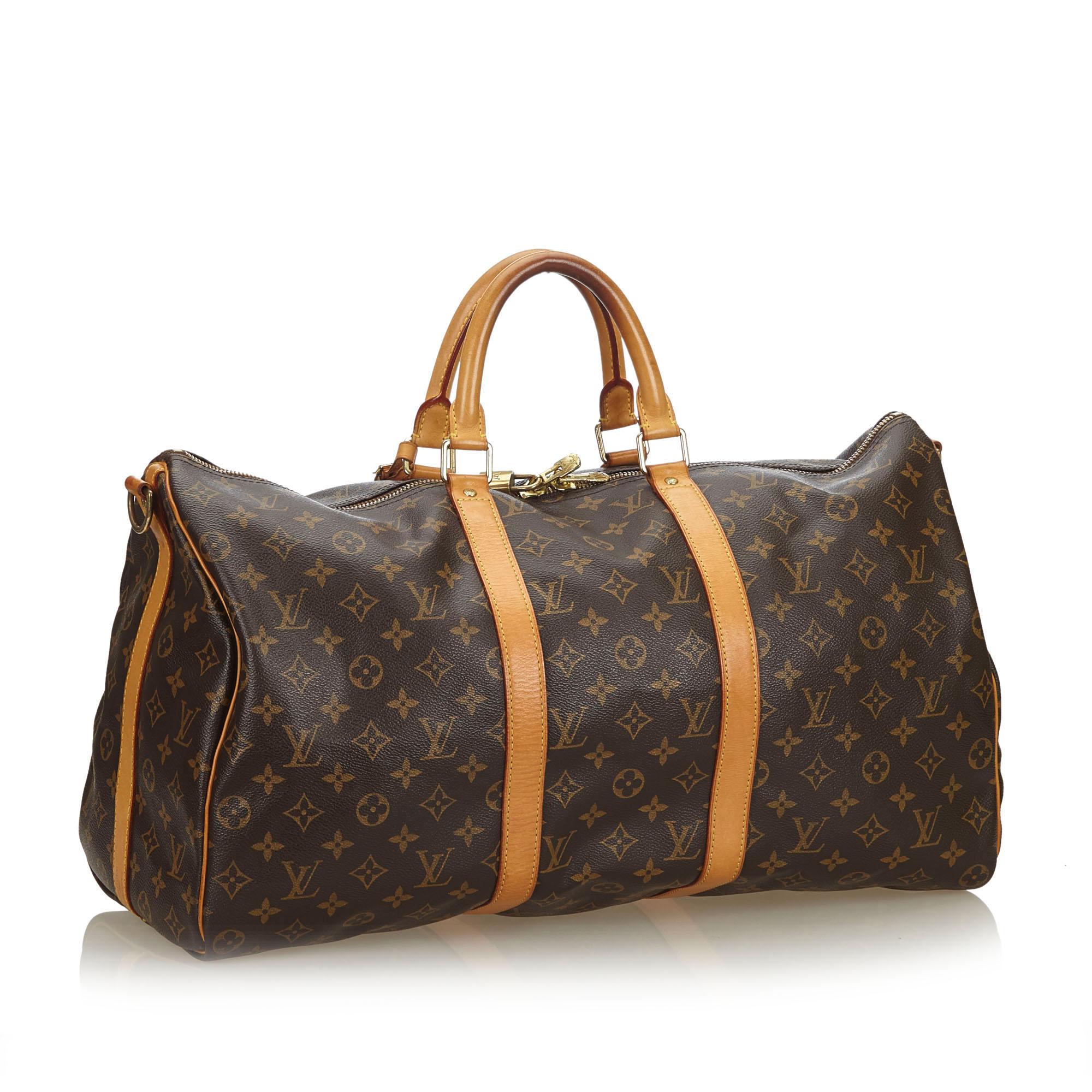 The Keepall Bandouliere 50 features a monogram canvas body, rolled leather handles, a detachable shoulder strap, and a top zip closure. It carries as B+ condition rating.

Inclusions: 
Dust Bag
Padlock

Louis Vuitton pieces do not come with an