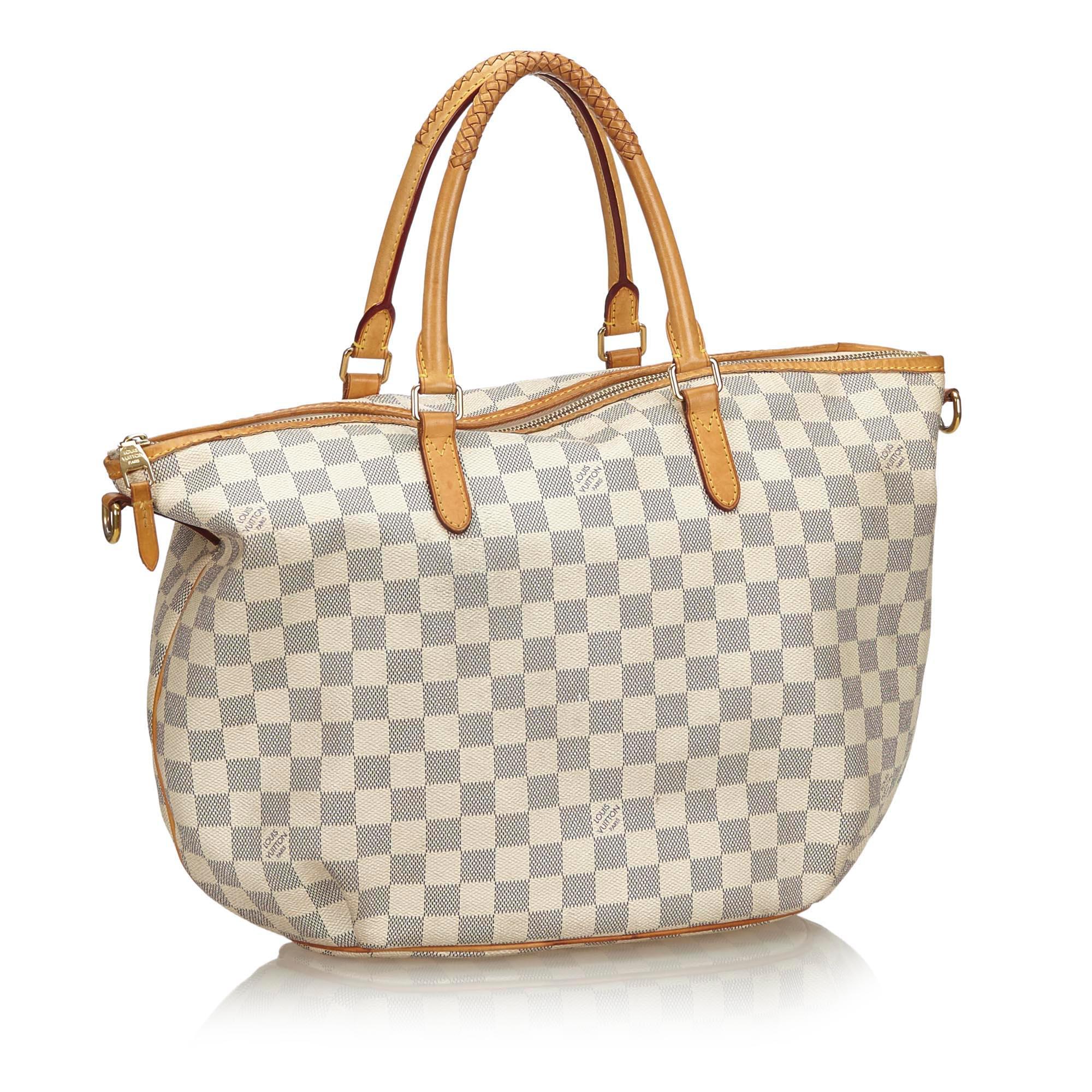 The Riviera features a damier azur body with vachetta leather trim, rolled leather handles, a detachable flat leather strap, a top zip closure, and interior slip pockets. It carries as B+ condition rating.

Inclusions: 
This item does not come with