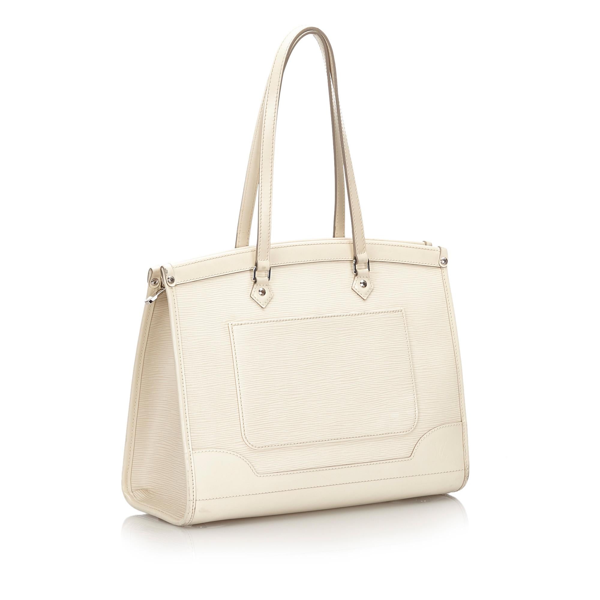 The Madeleine GM features an epi leather body, exterior back slip pocket, flat leather handles, top zip closure, and interior slip pockets. It carries as B+ condition rating.

Inclusions: 
This item does not come with inclusions.


Louis Vuitton