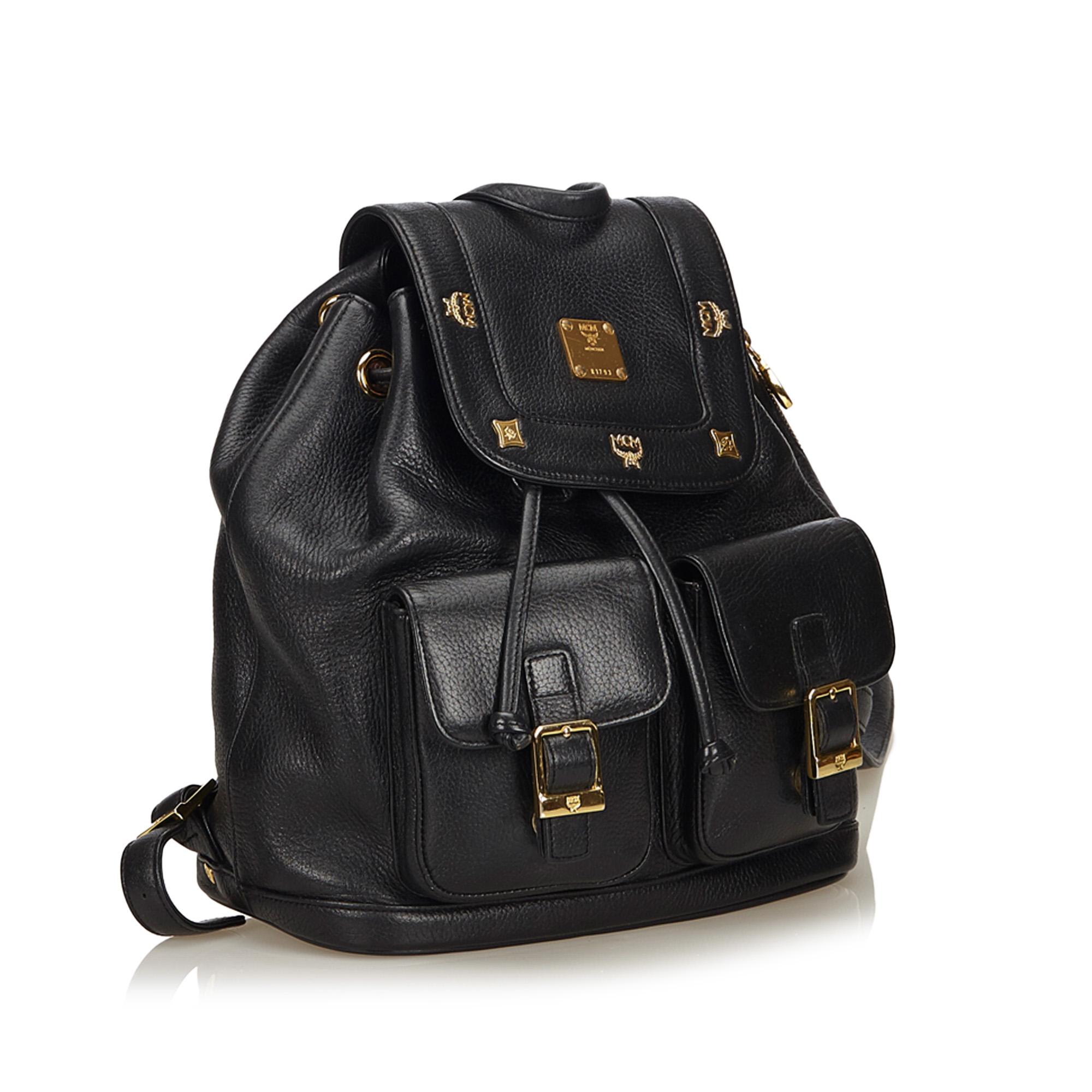 This backpack features a leather body, exterior front flap pockets, gold-tone hardware, flat leather straps, top flap with drawstring closure, and interior zip pocket. It carries as B condition rating.

Inclusions: 
This item does not come with
