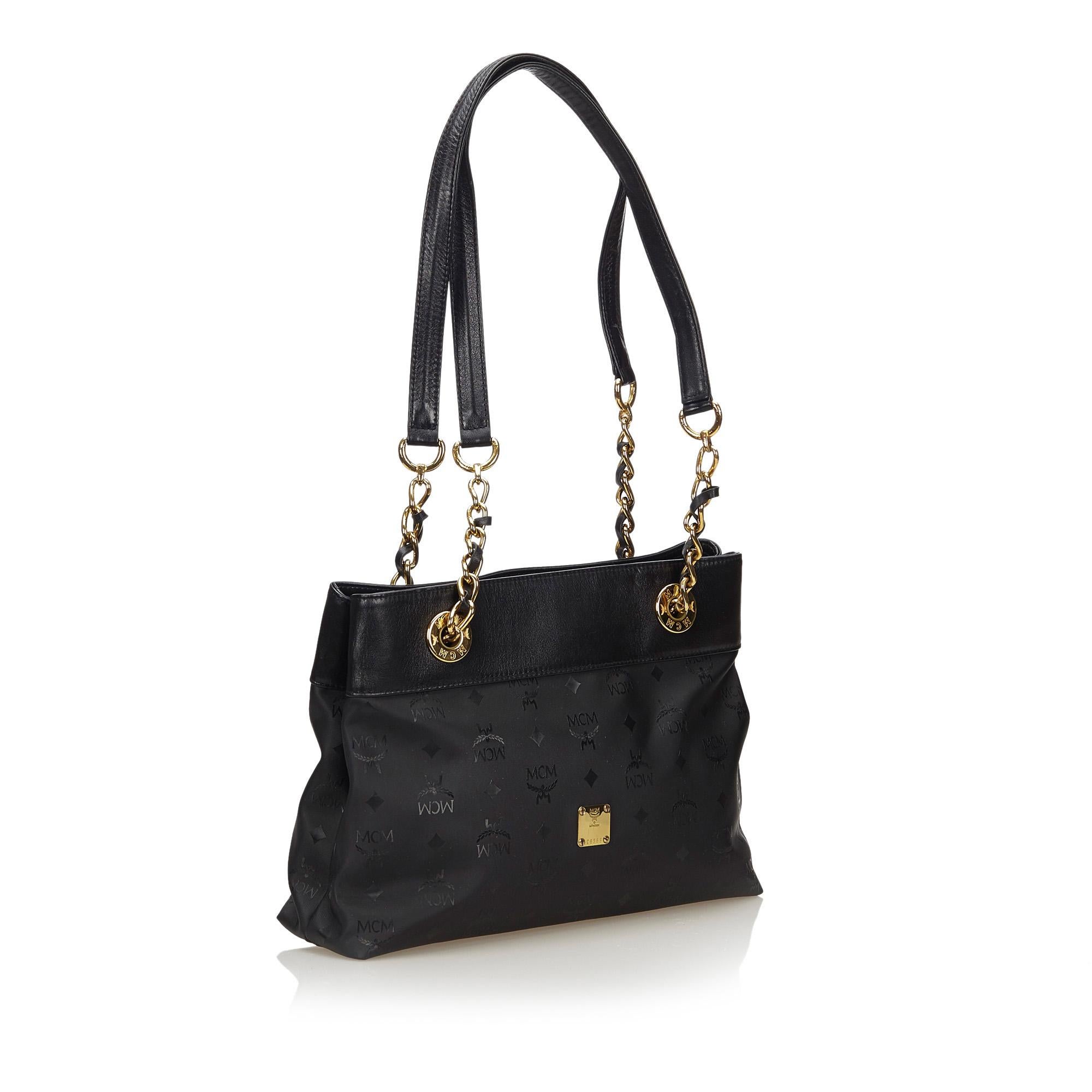 This shoulder bag features a PVC body, flat leather with gold-tone chain shoulder strap, magnetic closure, and interior zip pocket. It carries as B condition rating.

Inclusions: 
This item does not come with inclusions.

Dimensions:
Length: 33.00