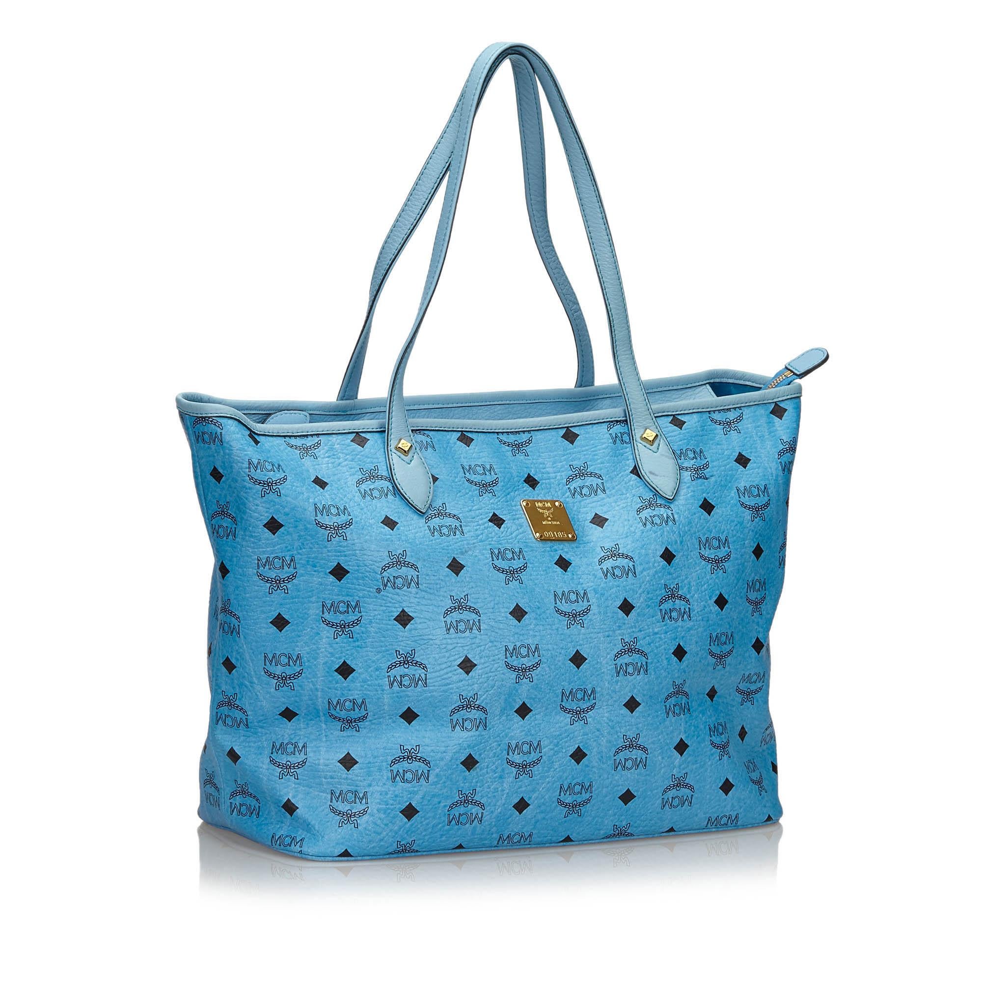 This tote bag features a leather body, flat leather straps, top zip closure, interior slip pockets, and an interior zip pocket. It carries as AB condition rating.

Inclusions: 
This item does not come with inclusions.

Dimensions:
Length: 28.00