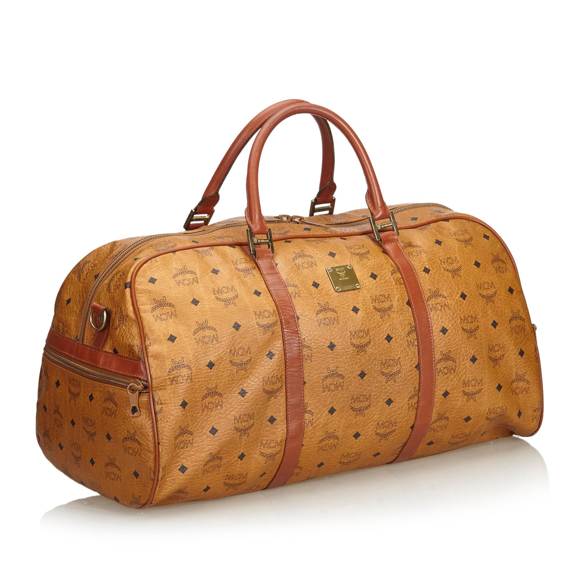 This duffle bag features a leather body, rolled leather handles, a detachable flat strap, a top zip closure, and an interior zip pocket. It carries as B condition rating.

Inclusions: 
This item does not come with inclusions.

Dimensions:
Length: