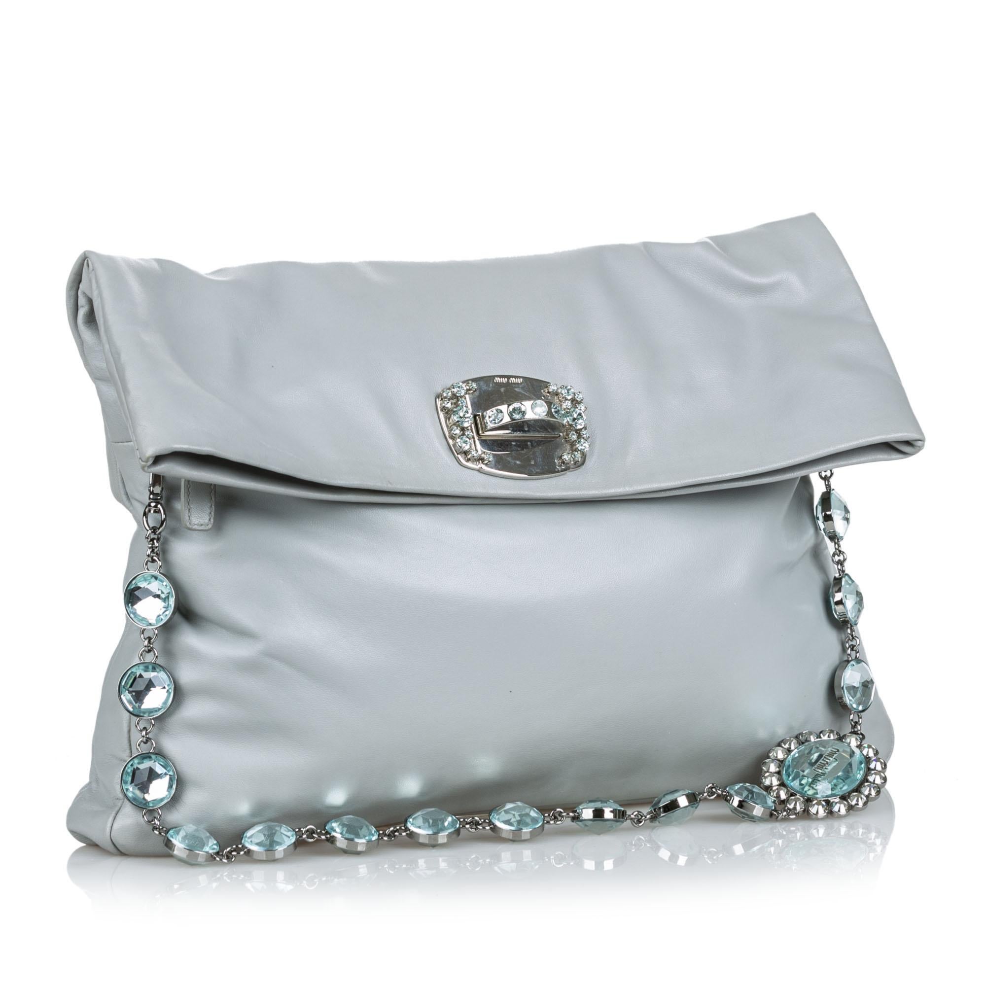 This shoulder bag features a leather body, a crystal shoulder strap, a front flap with a twist lock closure, and an interior slip pocket. It carries as B+ condition rating.

Inclusions: 
This item does not come with inclusions.

Dimensions:
Length: