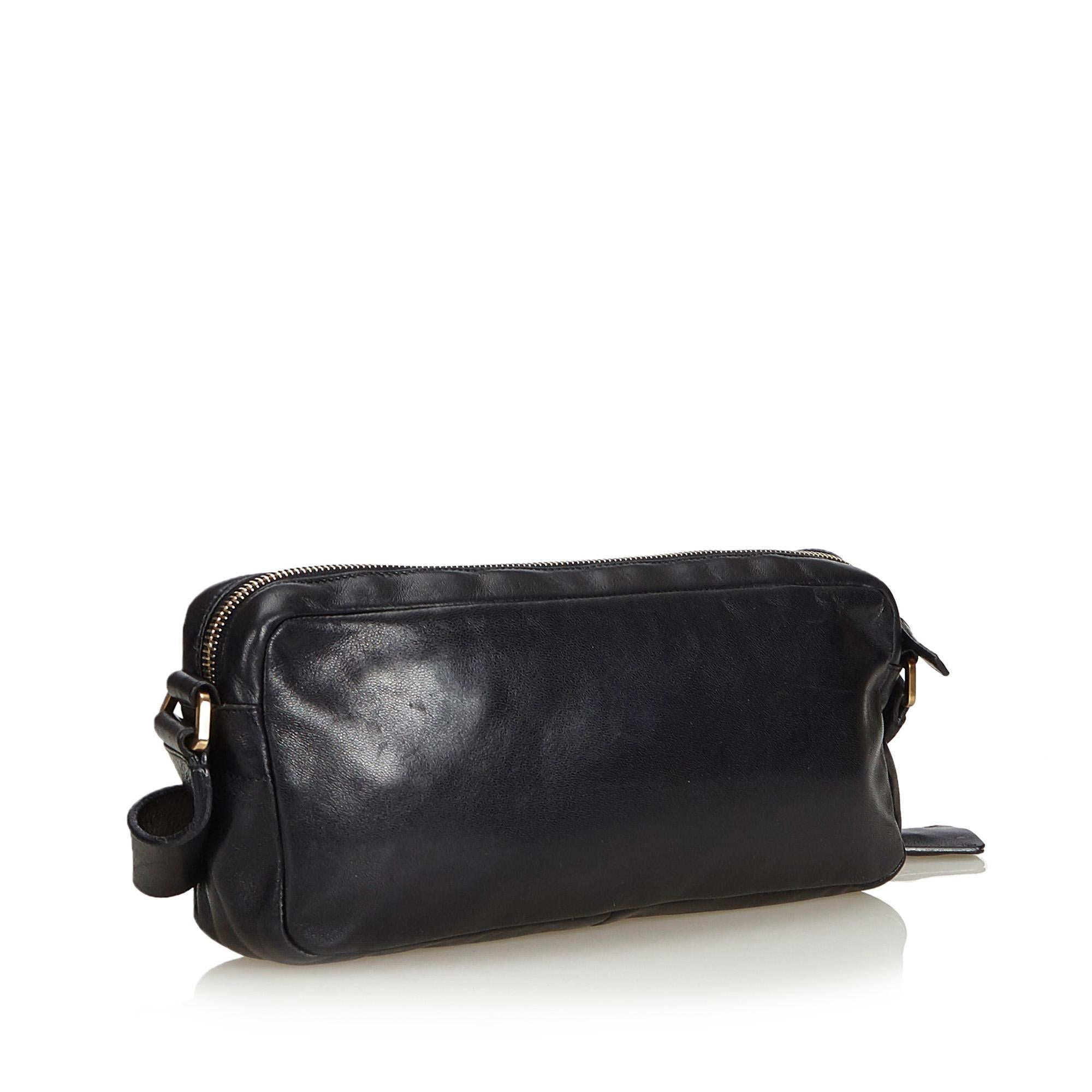 This baguette features a leather body, a front exterior slip pocket, a flat leather strap with gold-tone hardware, a top zip closure, and an interior zip pocket. It carries as B+ condition rating.

Inclusions: 
This item does not come with