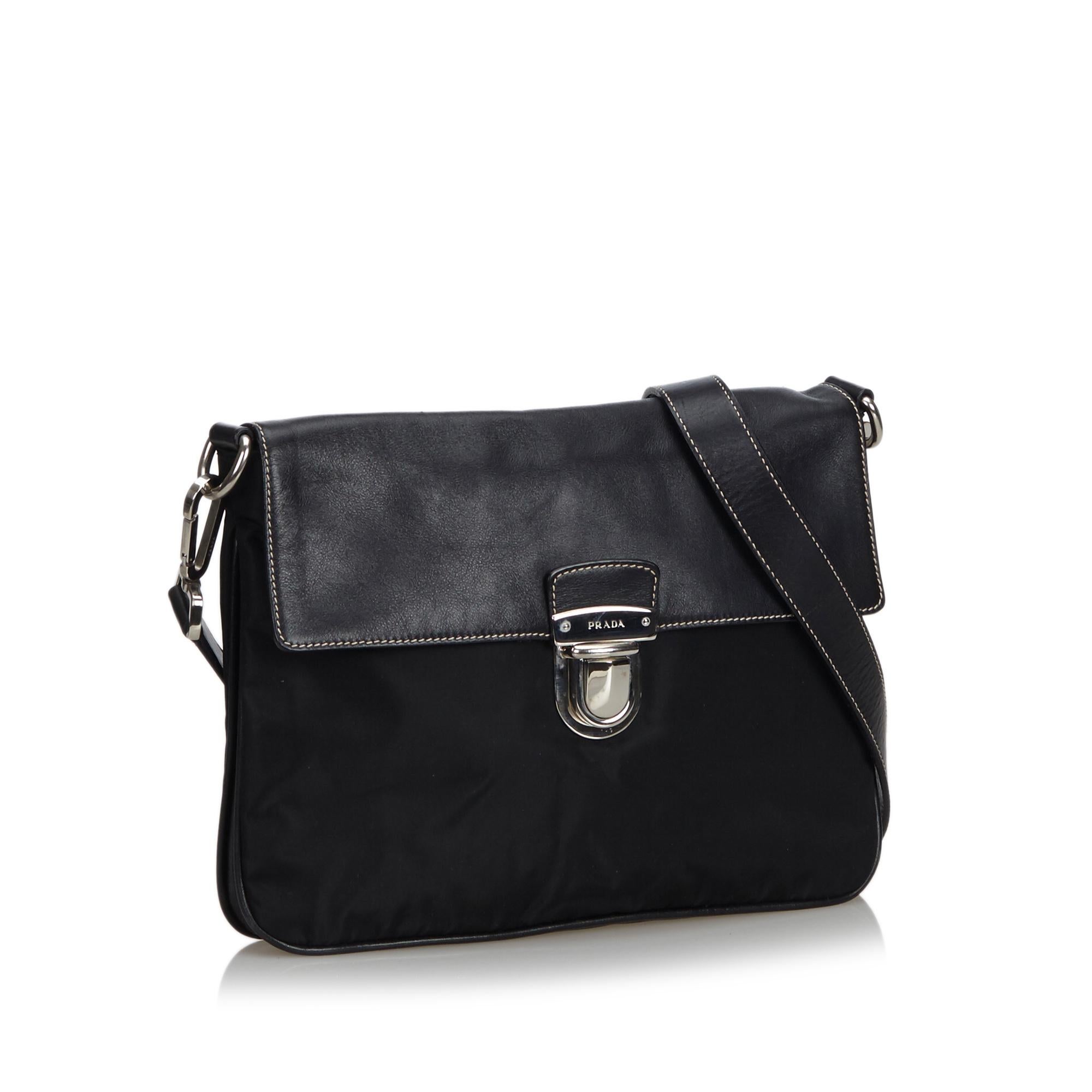 This crossbody bag features a leather body, an adjustable flat leather strap, a front flap with a push lock closure, and an interior zip pocket. It carries as B+ condition rating.

Inclusions: 
This item does not come with