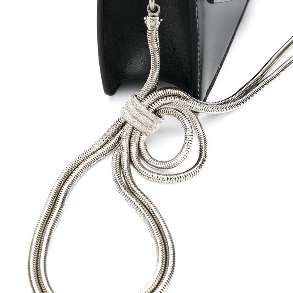 The Logo Liberty crossbody bag features a leather body, a silver-tone chain strap, a front flap with a metal twist lock closure, and interior zip and slip pockets. It carries as B+ condition rating.

Inclusions: 
This item does not come with
