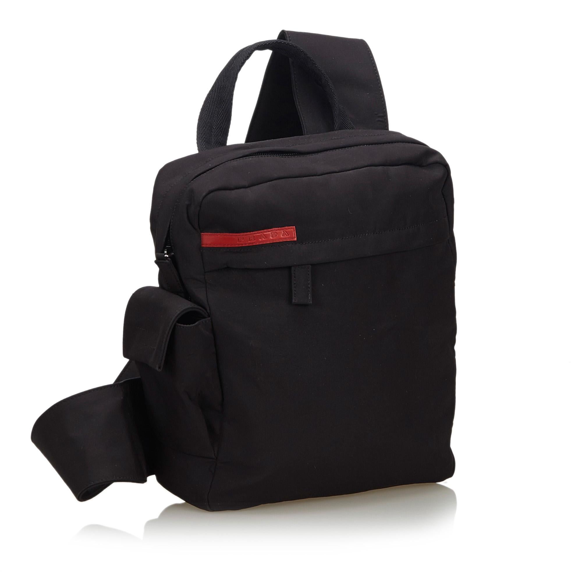 This backpack features a nylon body, flat top handle, flat back strap, top zip closure, exterior zip and flap pockets, and interior zip pocket. It carries as AB condition rating.

Inclusions: 
This item does not come with