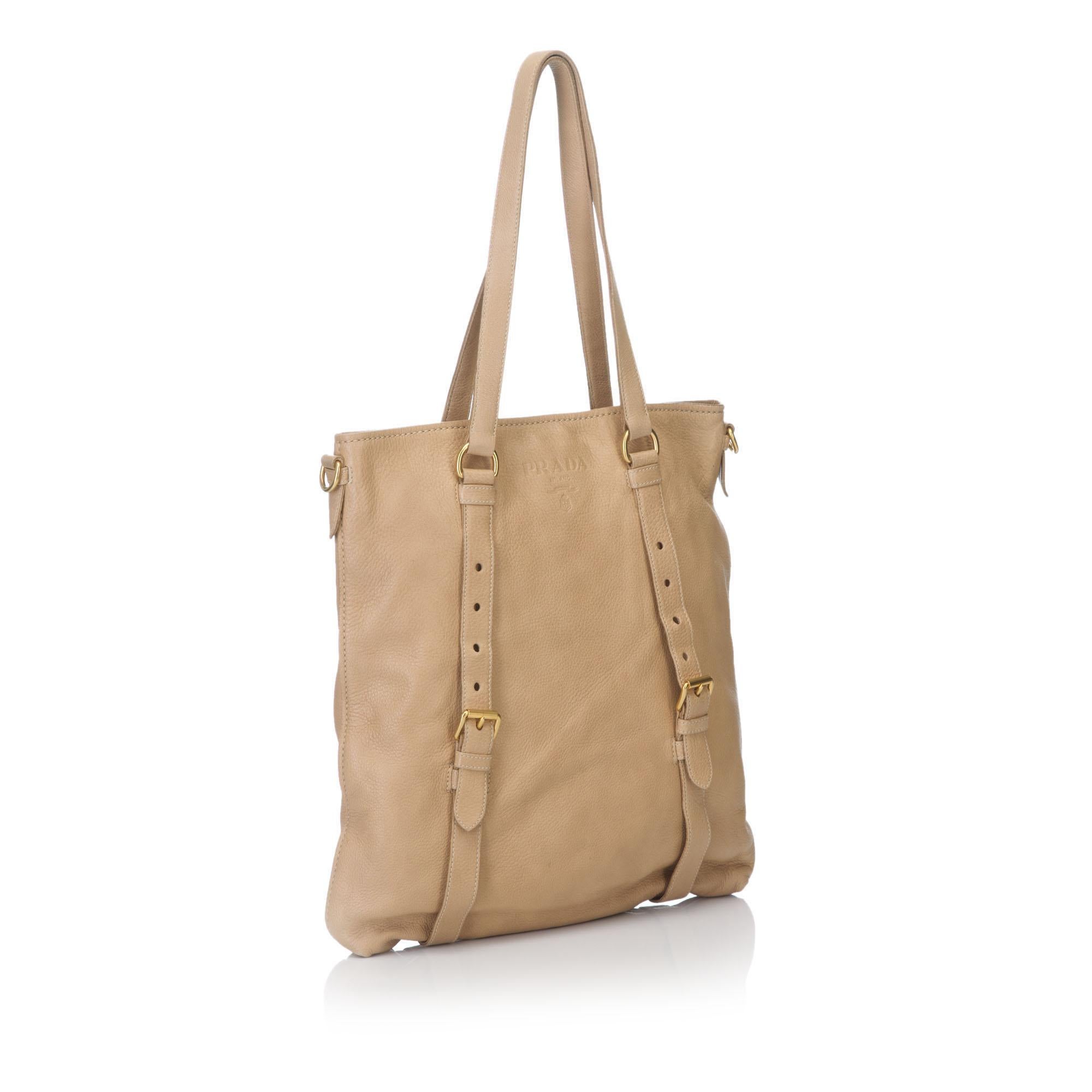 This tote bag features a leather body, flat leather straps, open top with magnetic closure, and interior zip and slip pockets. It carries as B condition rating.

Inclusions: 
This item does not come with inclusions.

Dimensions:
Length: 37.00