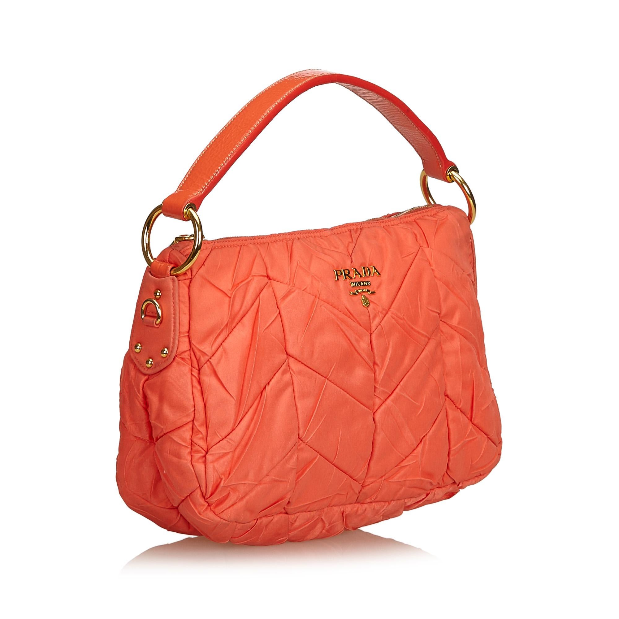 This shoulder bag features a quilted nylon body, flat leather shoulder strap, top zip closure, and an interior zip pocket. It carries as B+ condition rating.

Inclusions: 
This item does not come with inclusions.

Dimensions:
Length: 20.00 cm
Width: