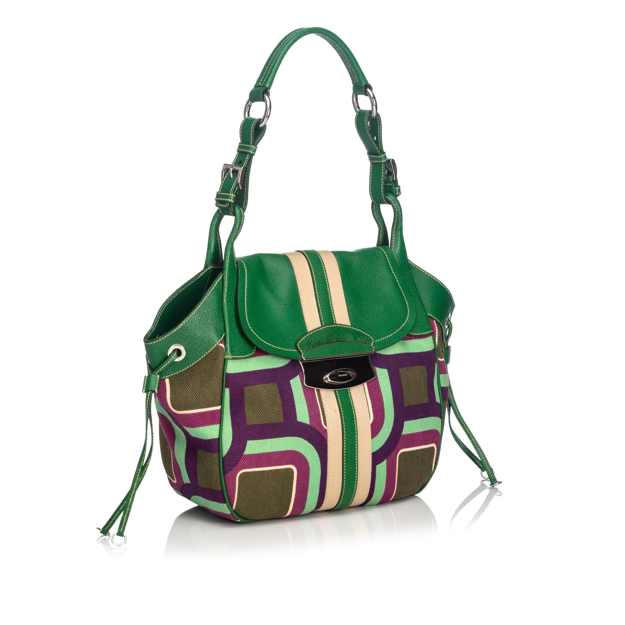 This shoulder bag features a printed canvas body with leather trim, a flat leather strap, a top flap, an open top with a magnetic closure, and an interior zip pocket. It carries as B+ condition rating.

Inclusions: 
Authenticity