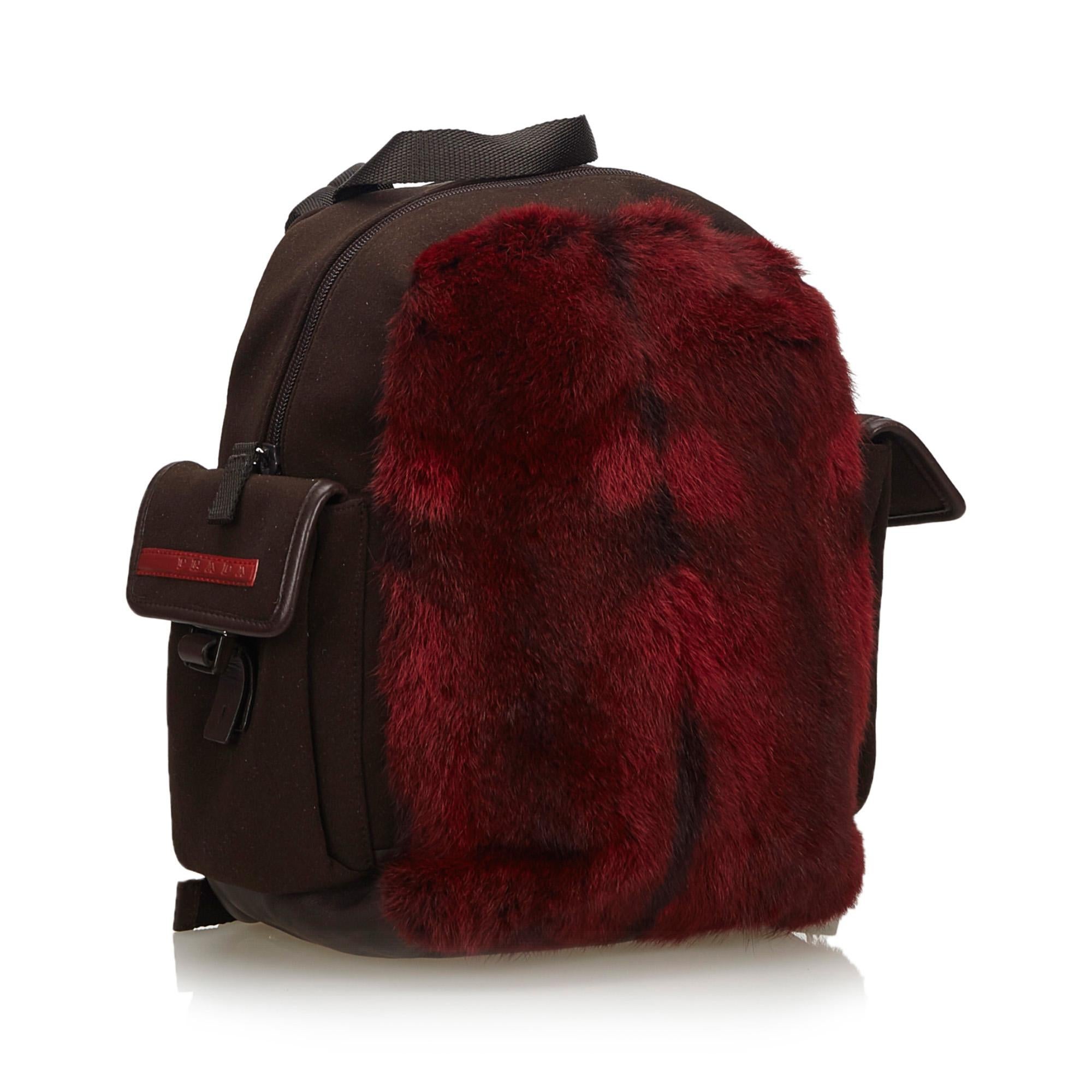This backpack features a fur body, side exterior flap pockets, flat back straps, a flat top handle, a top zip closure, and an interior zip pocket. It carries as AB condition rating.

Inclusions: 
This item does not come with