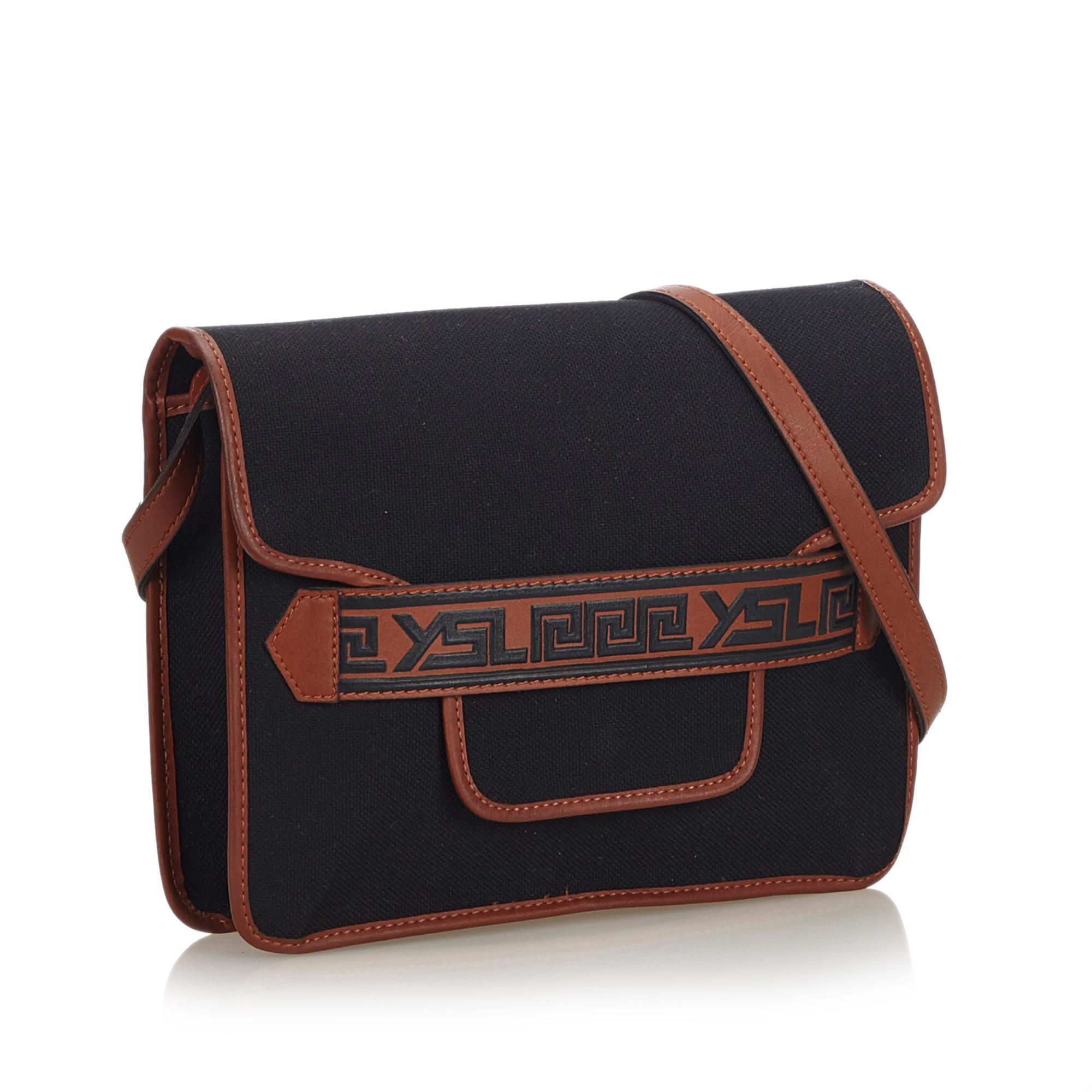 This crossbody bag features a canvas body with leather trim, a front flap with magnetic closure, and interior zip and slip pockets. It carries as AB condition rating.

Inclusions: 
This item does not come with inclusions.

Dimensions:
Length: 22.00
