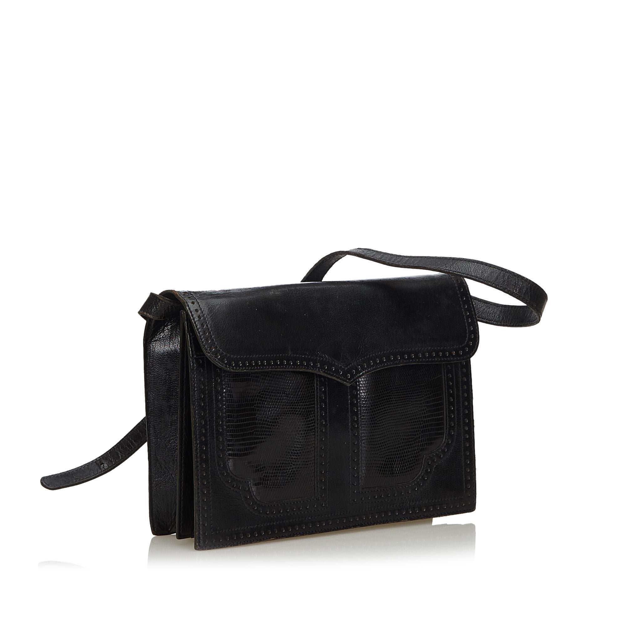 This shoulder bag features a leather body, a flat leather strap, a top flap with a magnetic closure, and interior zip and slip pockets. It carries as B condition rating.

Inclusions: 
This item does not come with inclusions.

Dimensions:
Length: