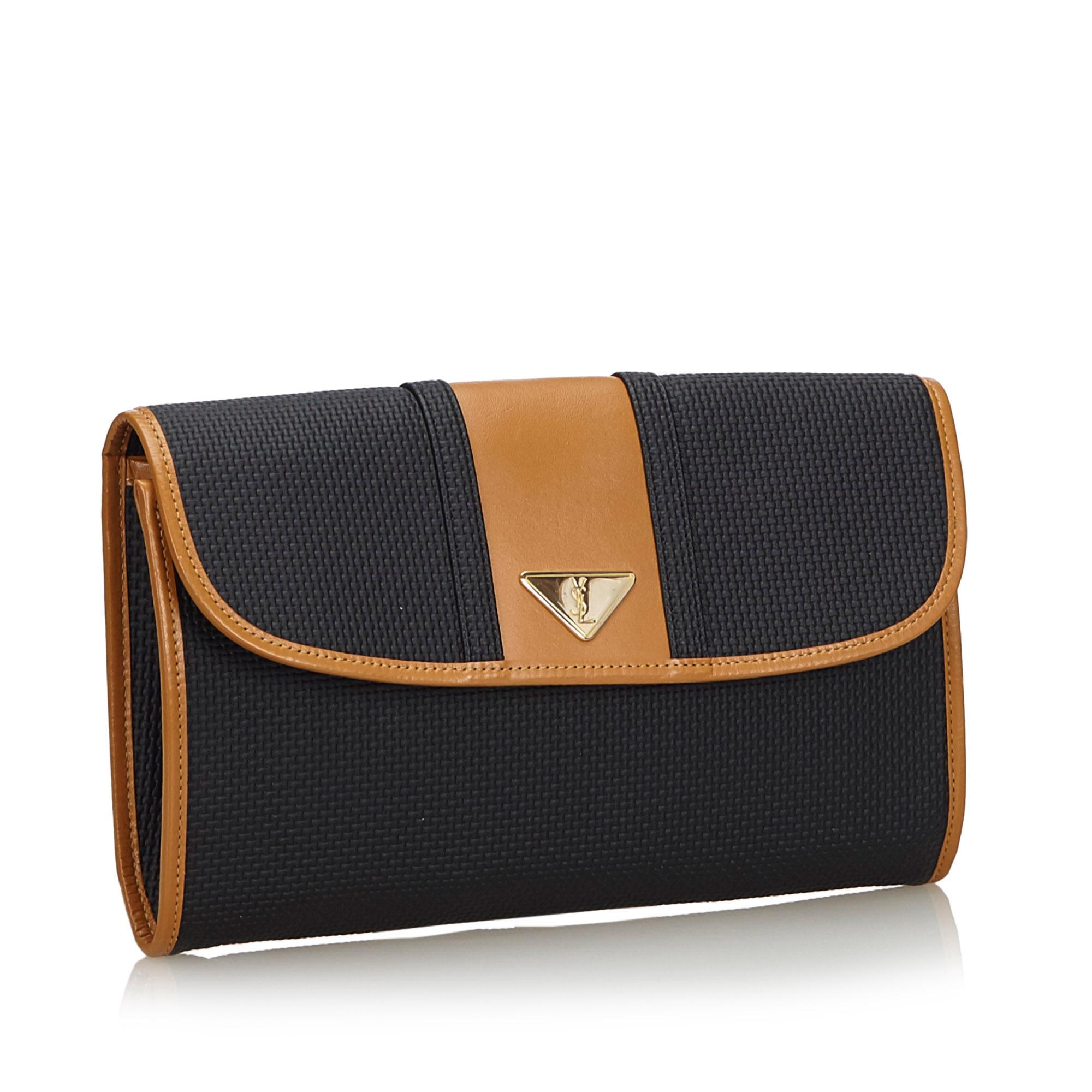 This clutch bag features a PVC body with leather trim, a front flap with magnetic closure, and interior zip and slip pockets. It carries as AB condition rating.

Inclusions: 
This item does not come with inclusions.

Dimensions:
Length: 18.00