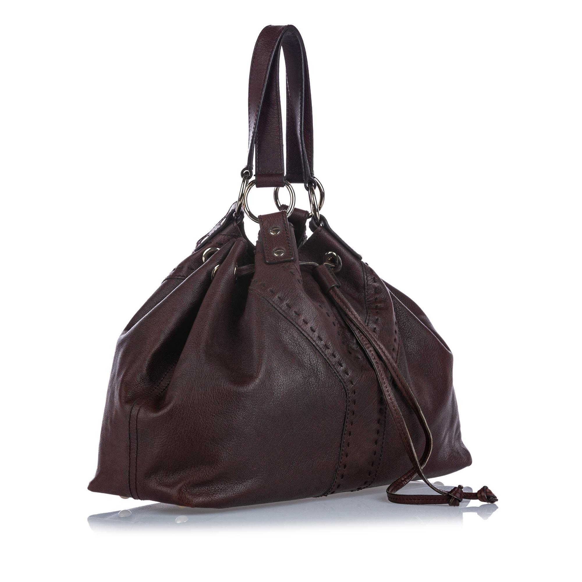 The Double Sac features a leather body, flat leather straps, and a top drawstring closure. It carries as B+ condition rating.

Inclusions: 
This item does not come with inclusions.

Dimensions:
Length: 28.00 cm
Width: 36.00 cm
Depth: 10.00