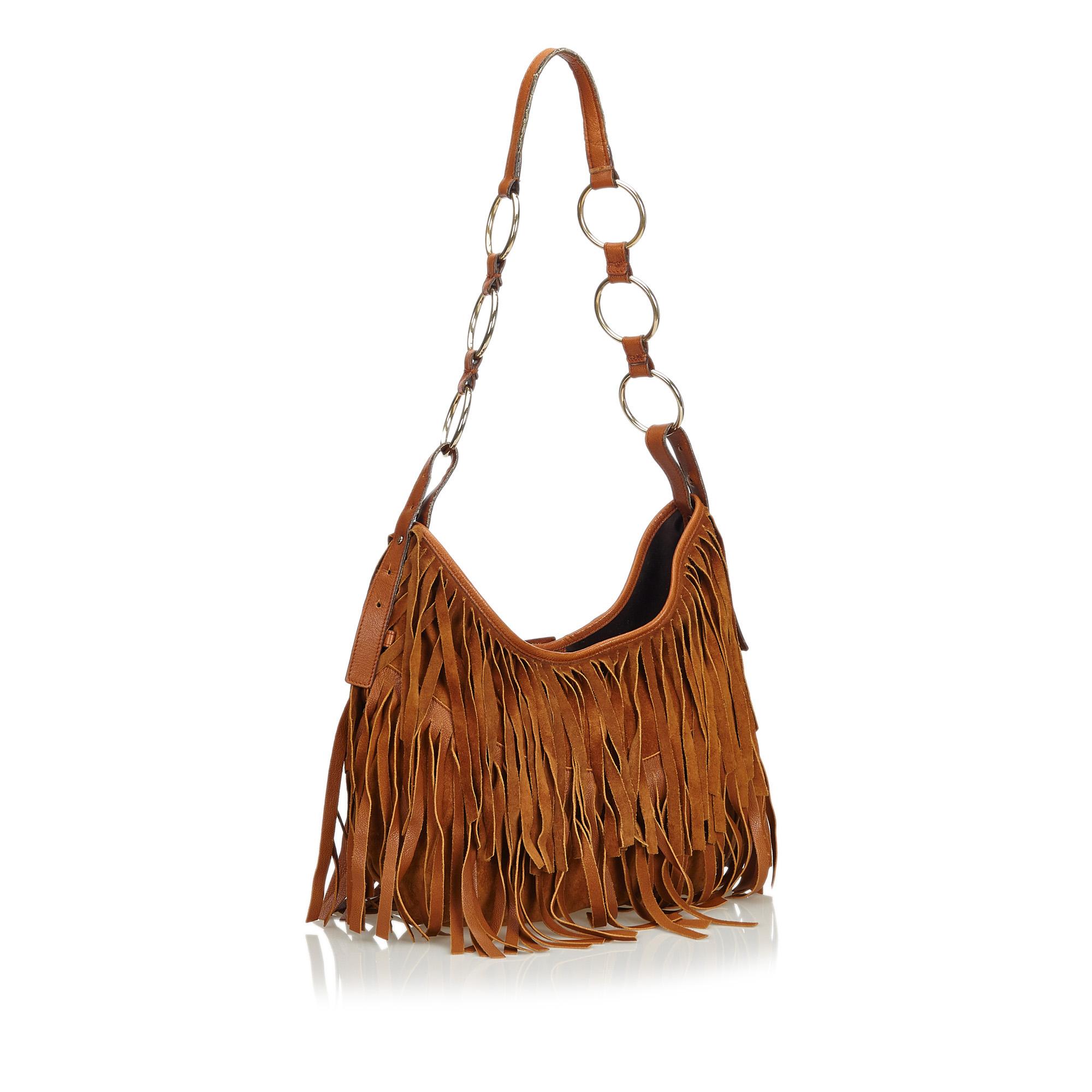 This hobo bag features a fringed suede leather body, a flat leather strap, a top magnetic closure, and an interior slip pocket. It carries as B+ condition rating.

Inclusions: 
This item does not come with inclusions.

Dimensions:
Length: 24.00