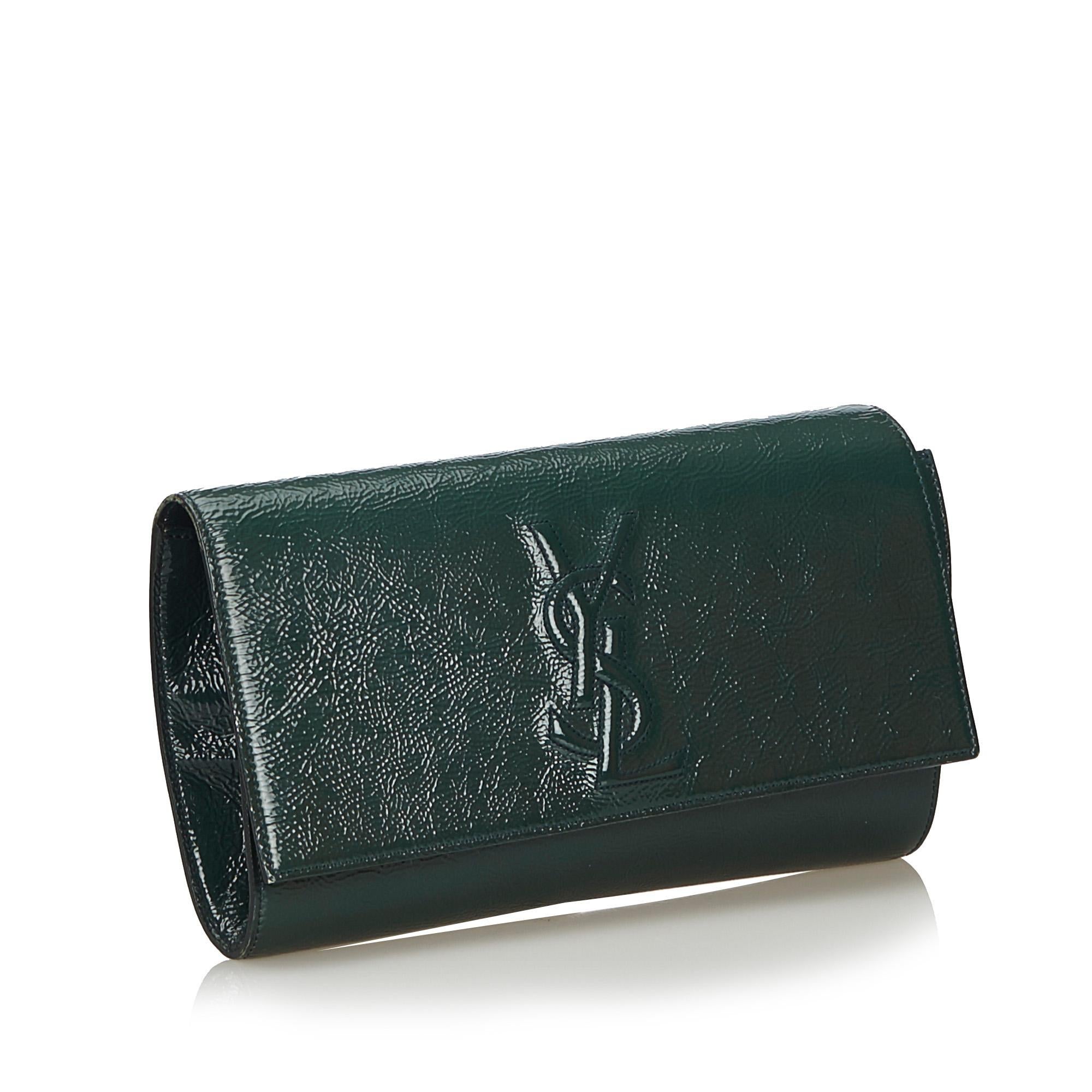 This clutch features a patent leather body, a front flap with a magnetic closure, and an interior slip pocket. It carries as AB condition rating.

Inclusions: 
Dust Bag

Dimensions:
Length: 18.00 cm
Width: 29.00 cm
Depth: 2.00 cm

Material: Leather