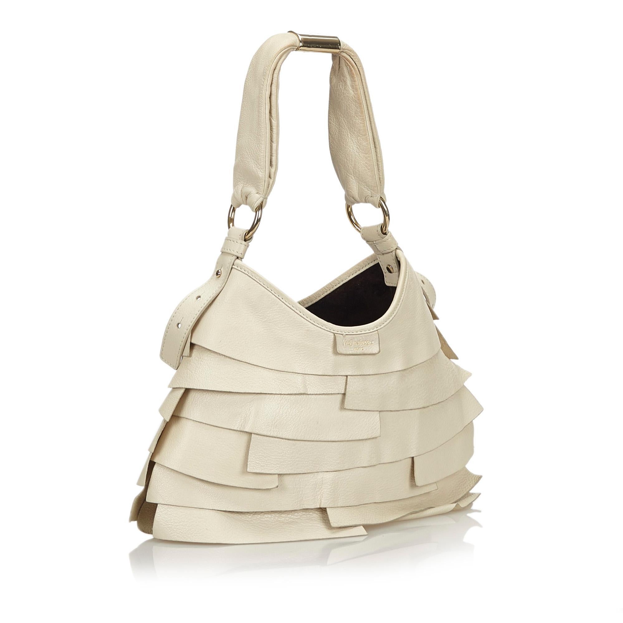 The Saint Tropez features a ruffled leather body, a flat leather strap, a top magnetic closure, and interior zip and slip pockets. It carries as B+ condition rating.

Inclusions: 
Dust Bag

Dimensions:
Length: 22.00 cm
Width: 30.00 cm
Depth: 2.00