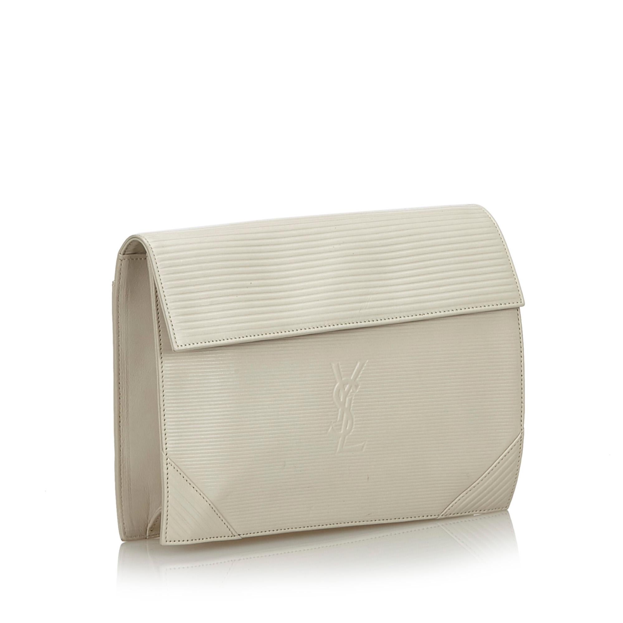 This clutch bag features a leather body, a top flap with magnetic snap button closure, and an interior zip pocket. It carries as B+ condition rating.

Inclusions: 
This item does not come with inclusions.

Dimensions:
Length: 18.00 cm
Width: 24.00