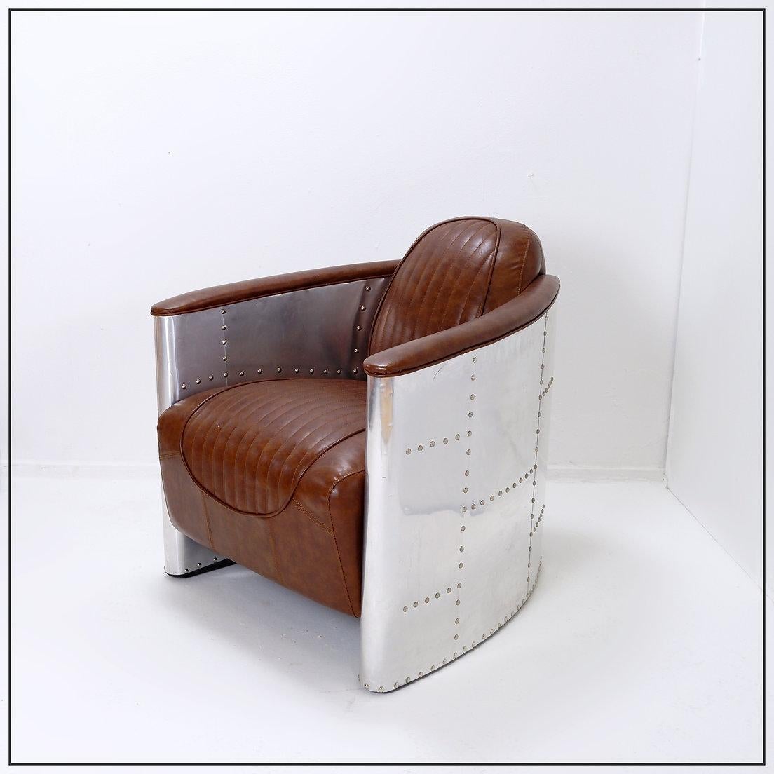 Industrial Vintage Aviator armchair riveted aluminum and cognac leather For Sale