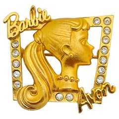 AVON Barbie broche vintage en cristal doré 