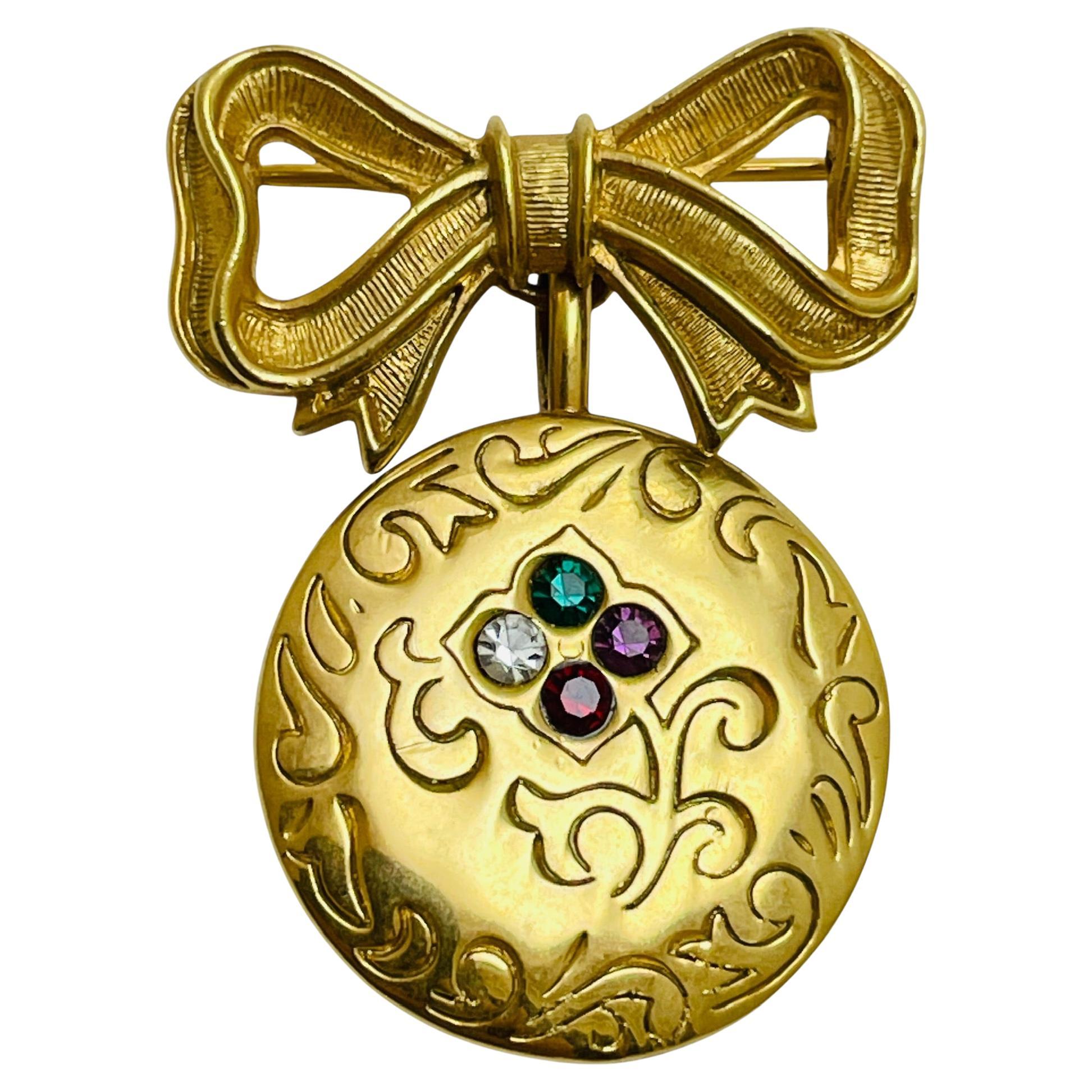 Broche colgante vintage AVON firmado en tono dorado con brillantes en venta