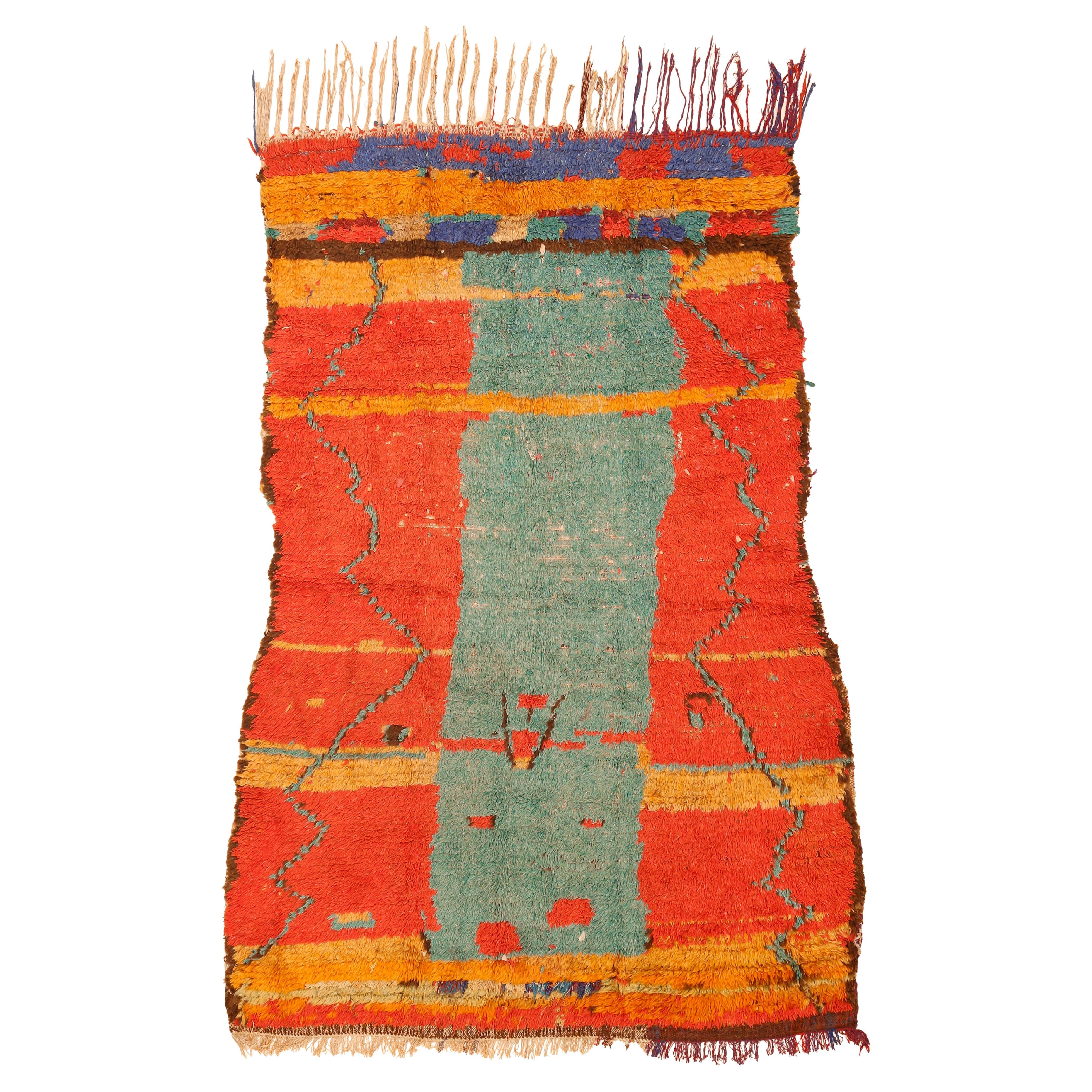 Vintage Azilal Moroccan Berber Rug with a Green Monolith on an Orange Background