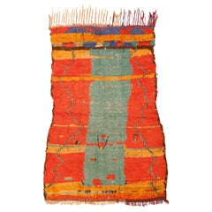 Retro Azilal Moroccan Berber Rug with a Green Monolith on an Orange Background