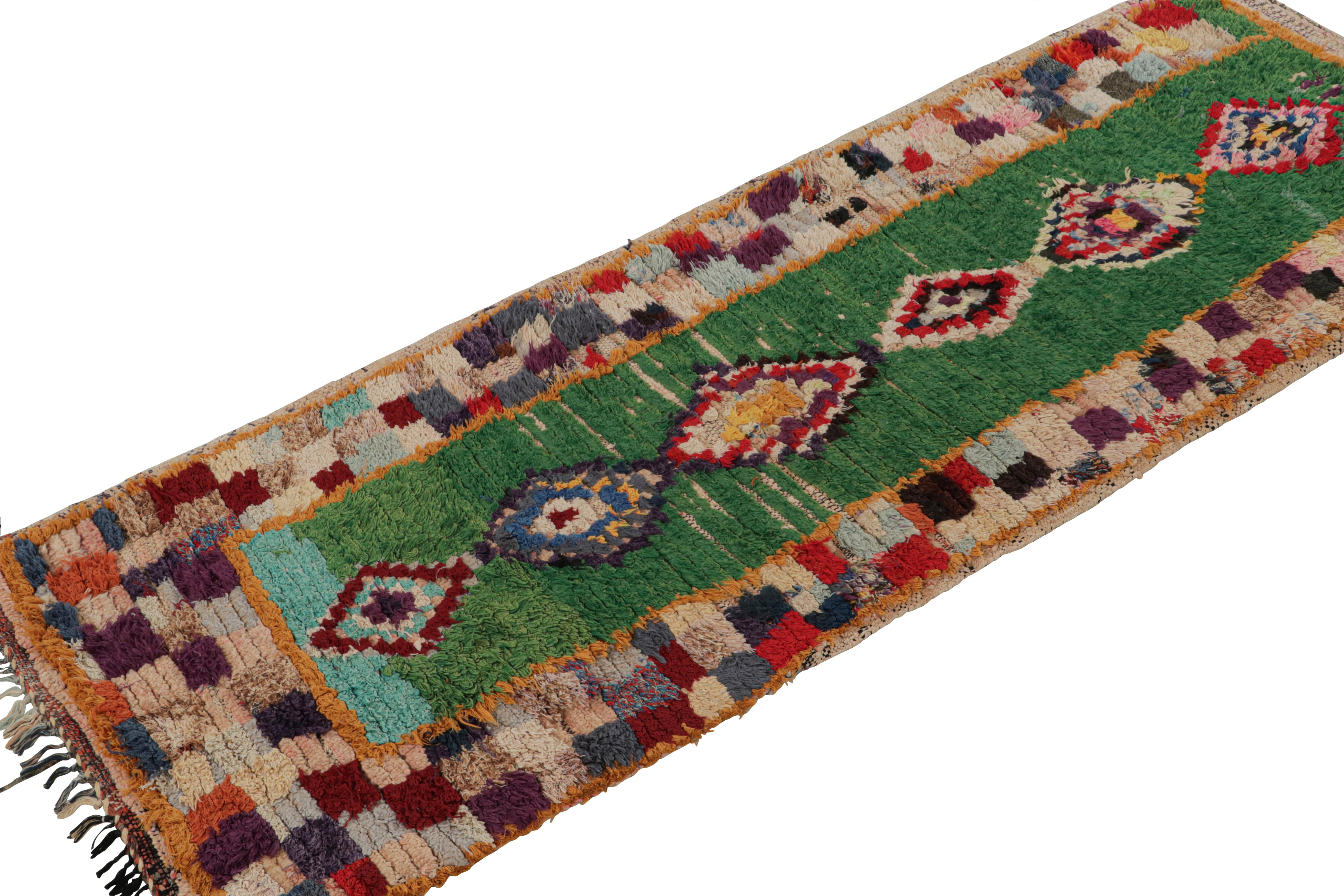 Hand-knotted in wool and cotton, circa 1950-1960, this 2x6 vintage Moroccan rug is believed to hail from the Azilal tribe. 

On the Design: 

This piece enjoys a lush high pile with polychromatic primitivist Berber geometric diamond or lozenges