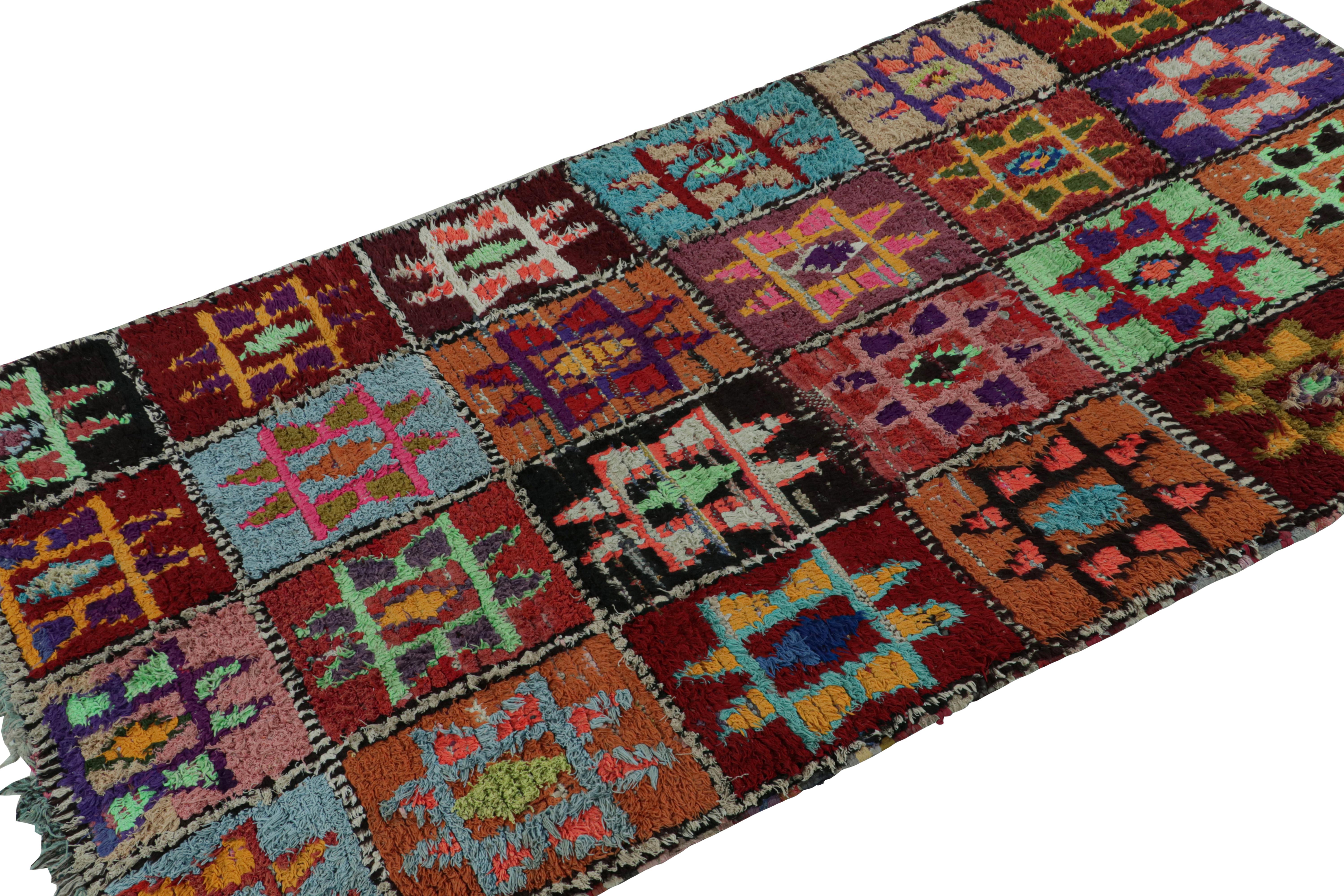 Hand-knotted in wool and cotton circa 1950-1960, this vintage 4x8 Moroccan rug is believed to hail from the Azilal tribe. 

On the Design: 

This rug enjoys a whimsical play of colors in the archaic geometric patterns. Keen eyes will further admire