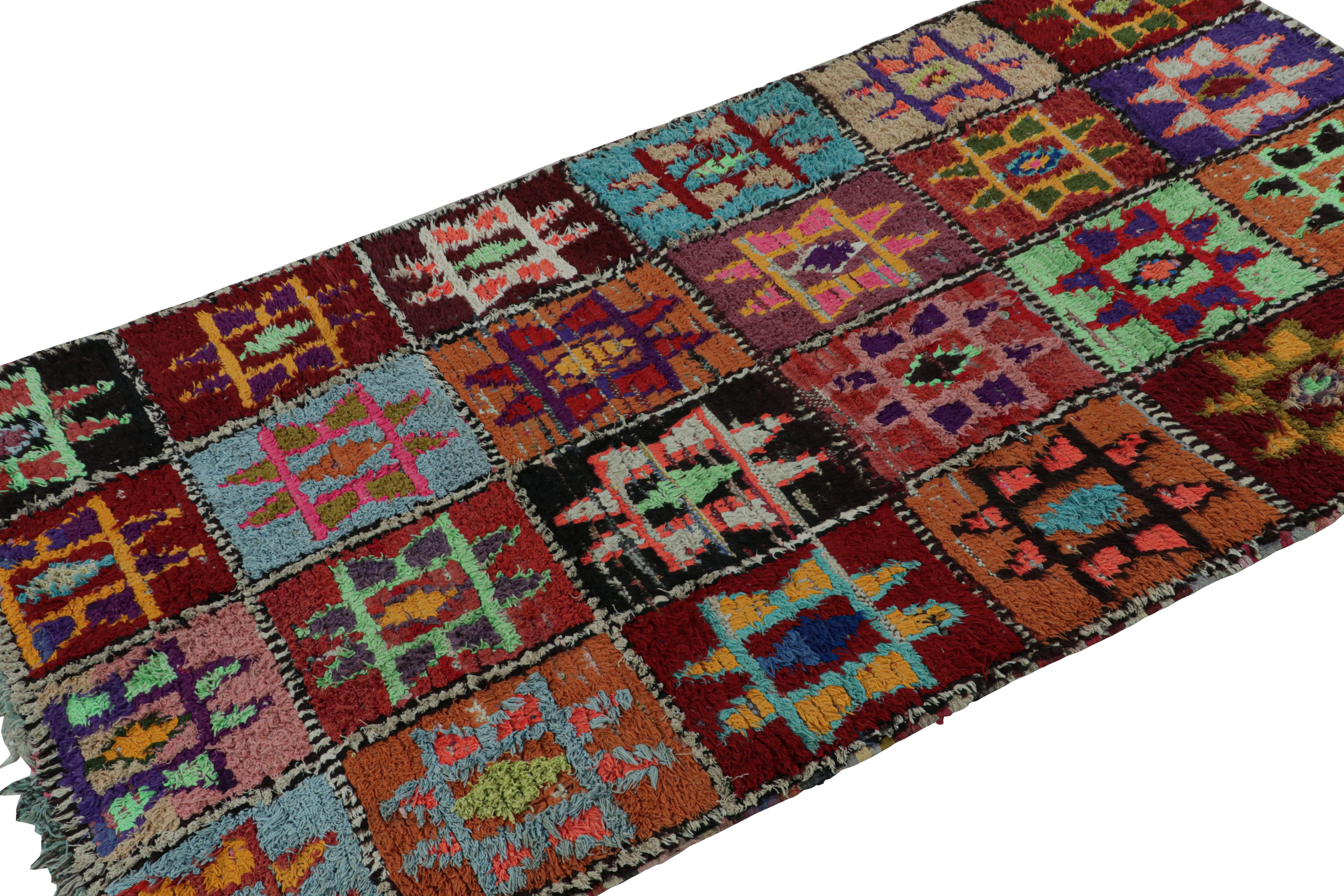 Hand-knotted in wool and circa 1950-1960, this vintage 4x8 Moroccan rug is believed to hail from the Azilal tribe. 

On the Design: 

This rug enjoys a whimsical play of colors in the archaic geometric patterns. Keen eyes will further admire its