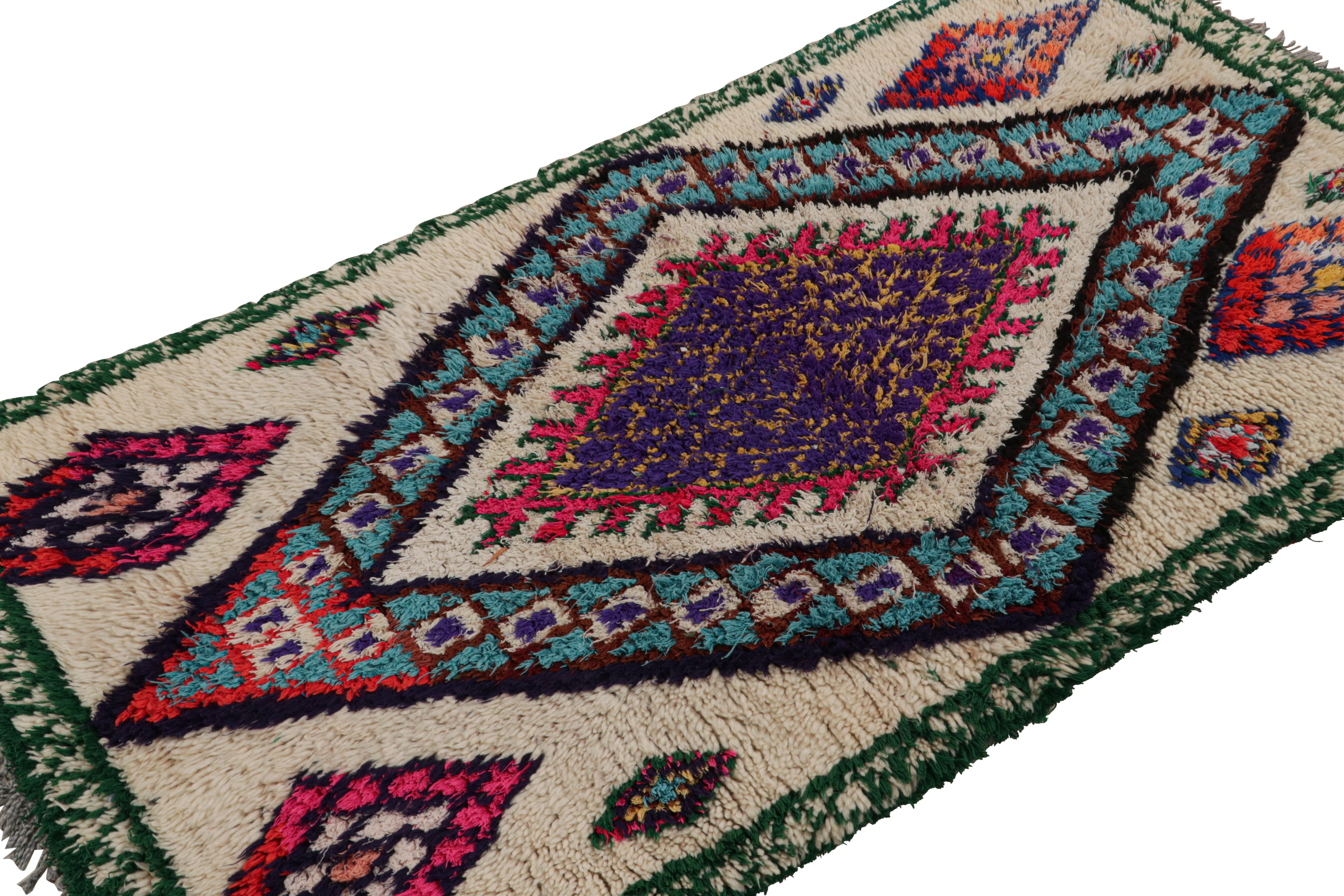 Hand-knotted in wool and cotton, circa 1950-1960, this 5x6 vintage Moroccan runner rug is believed to hail from the Azilal tribe. 

On the Design: 

This piece enjoys a lush high pile with polychromatic primitivist Berber geometric diamond medallion