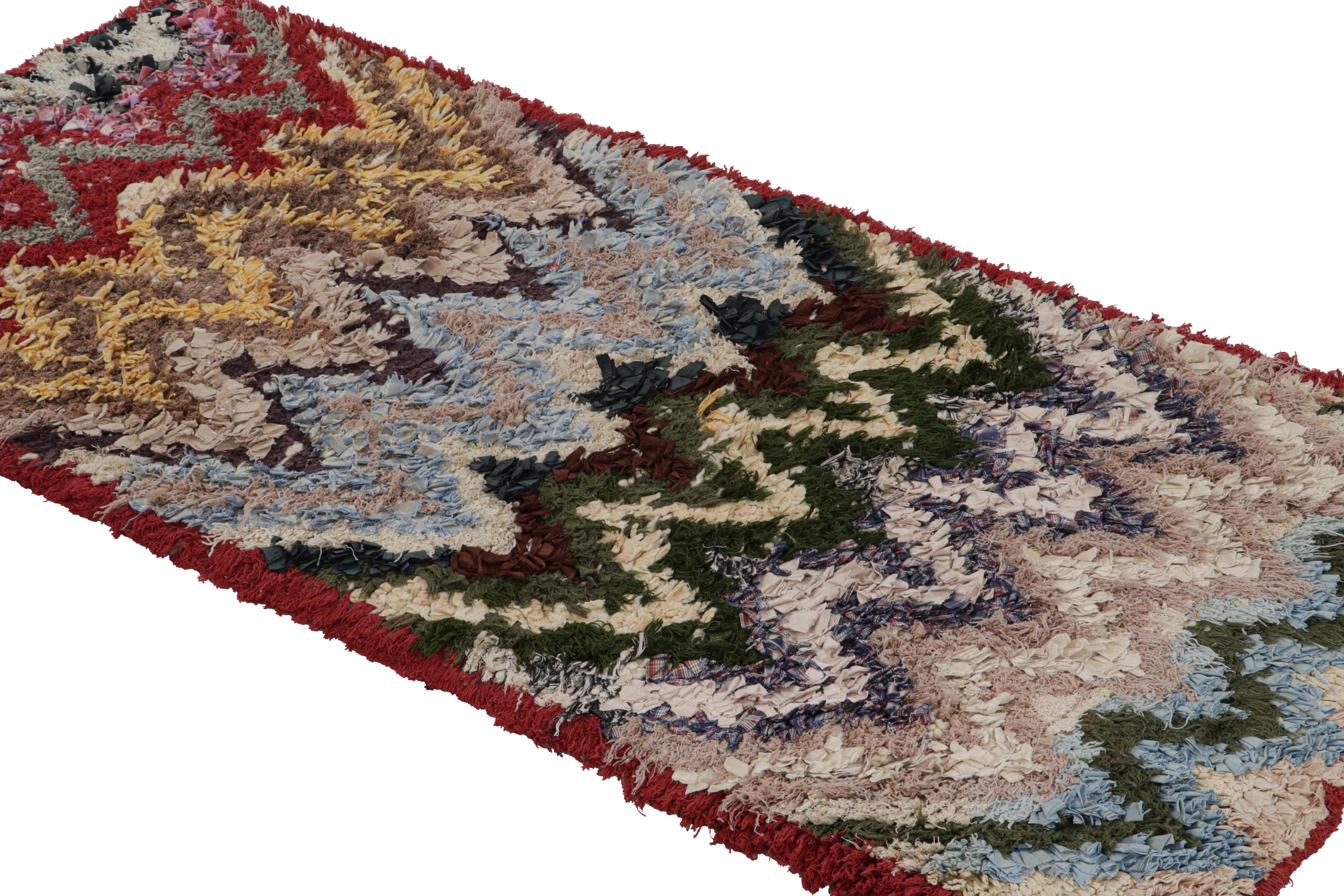 Hand-knotted in cotton and fabric circa 1950-1960, this vintage 3x6 Moroccan Boucherouite runner is believed to hail from the Azilal tribe. 

On the Design: 

This runner enjoys an interesting play of red, blue, green and gold tones in the chevron