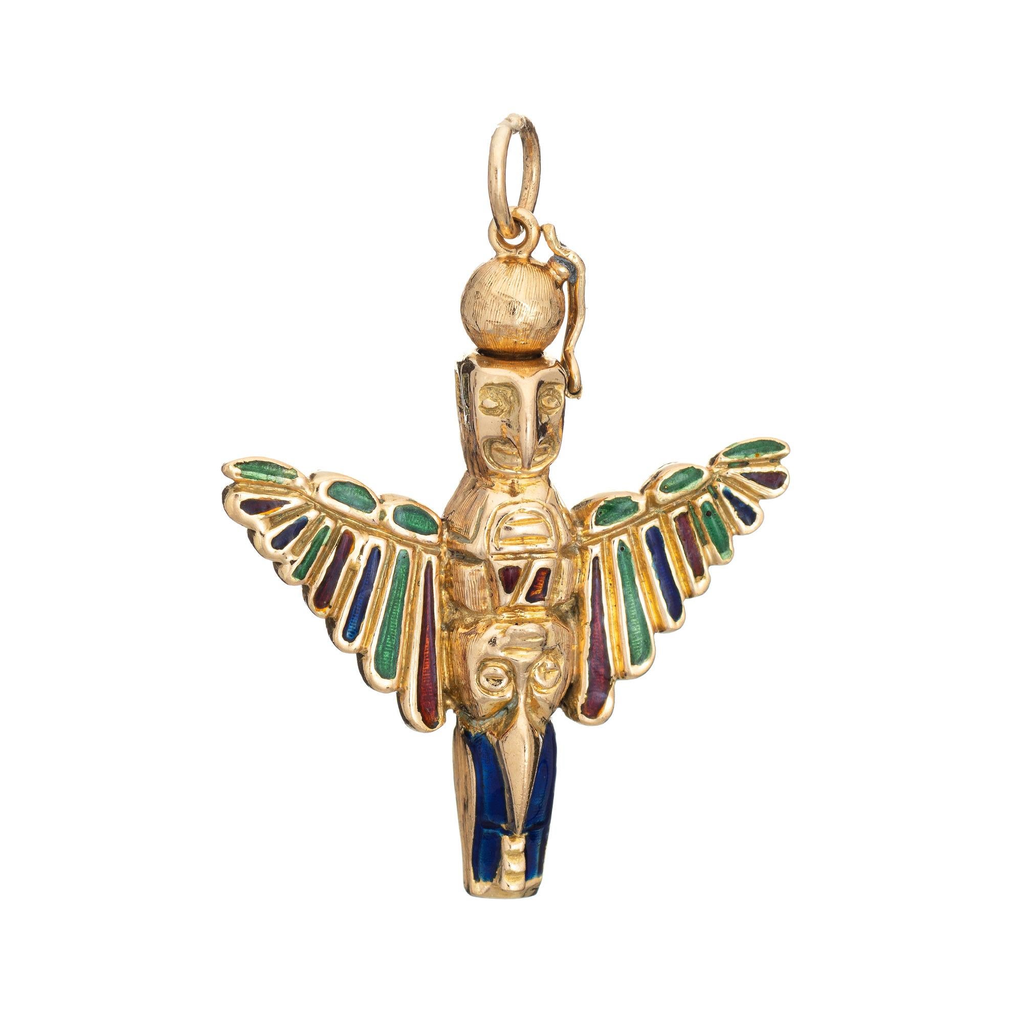 Finely detailed vintage Aztec pendant crafted in 18k yellow gold.  

Blue, green and red enamel is set into the wings.

The finely detailed pendant is double sided with what we believe is an Aztec inspired rendering on an eagle. The wings are