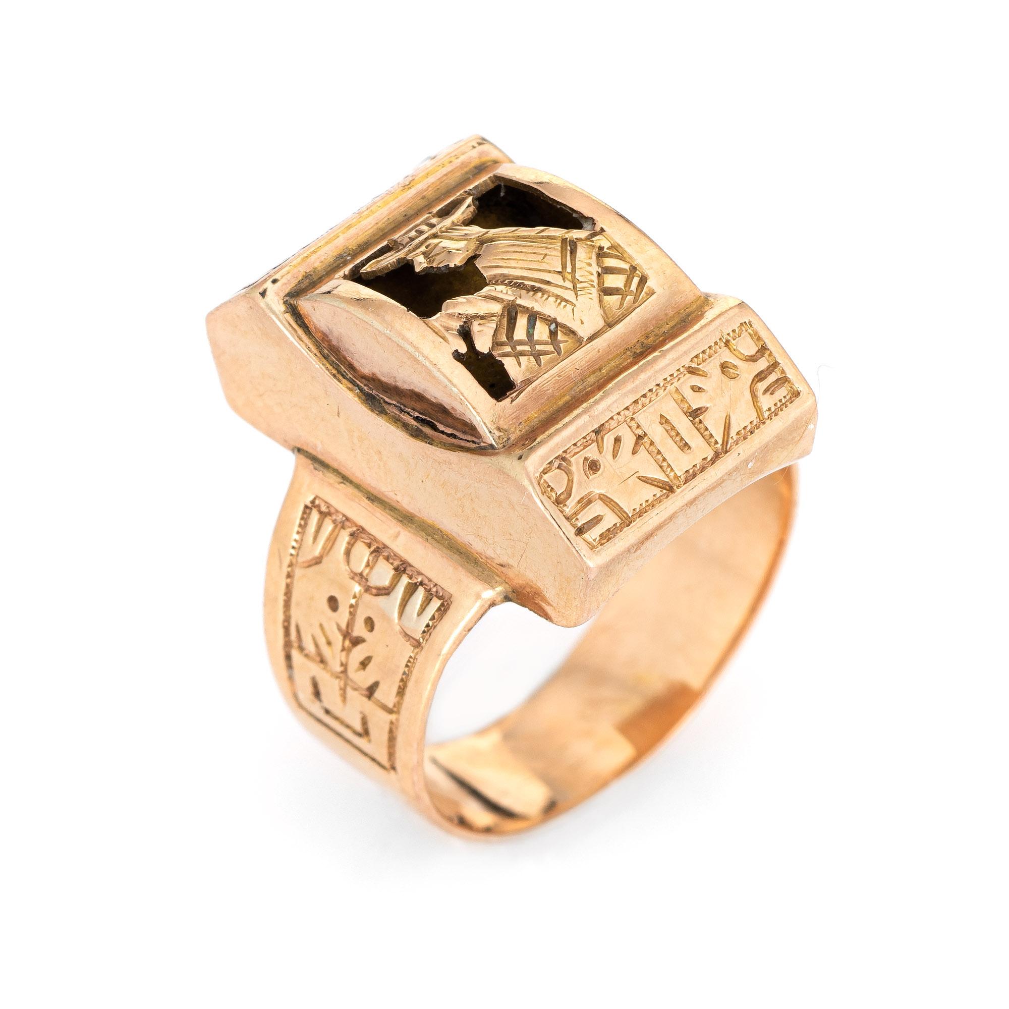 Finely detailed vintage Aztec ring crafted in 18 karat rose gold. 

The ring features a low dome mount with a cut out figure dressed in a hat and shoulder cape. The side shoulders feature etched details of what appear to be animals. Aztec jewelry is