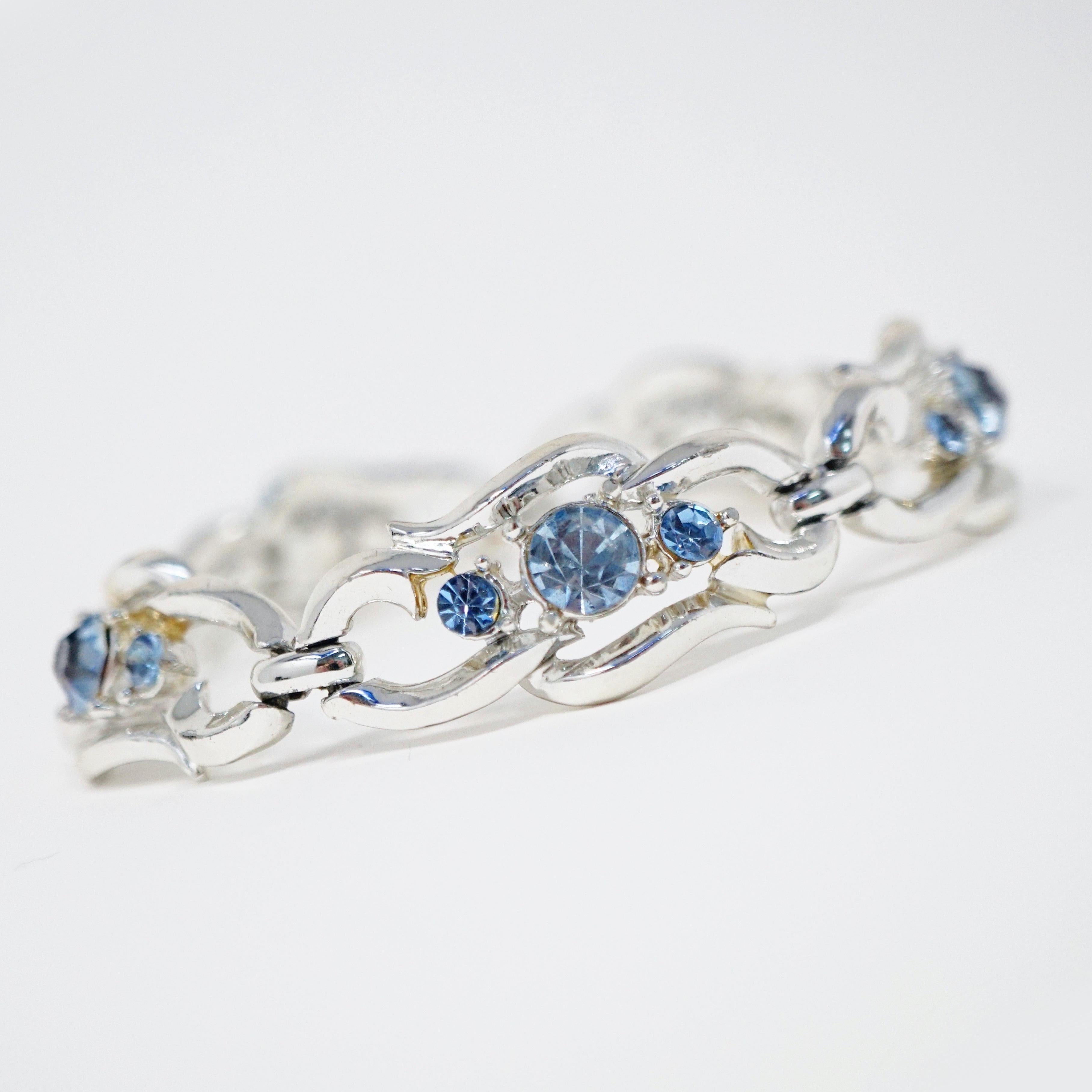 This gorgeous baby blue rhinestone bracelet by Coro, circa 1950s, is absolutely dreamy.  Rhodium plating and high quality crystal rhinestones will make your wrist sparkle and shine!  A wonderful 