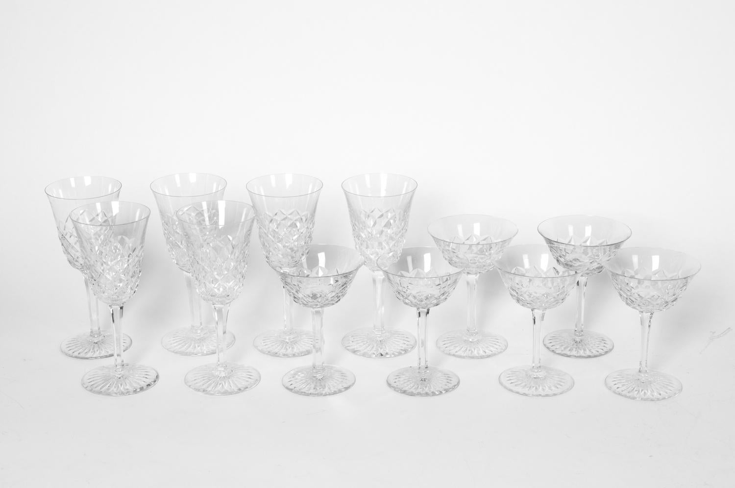 Vintage Baccarat crystal three sizes glassware set of 18 pieces. Each glass is in excellent condition, maker's mark undersigned. Each wine glass measure 8 inches x 3.4 inches. Each Champagne coupe measure: 5.5 inches x 4 inches. Each after dinner