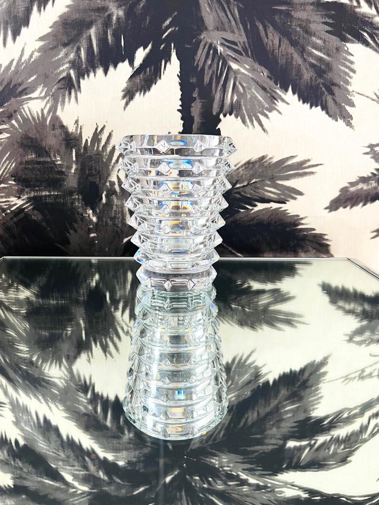 Handcrafted crystal vase by Baccarat with circular tiers and inverted diamond cuts. The vintage vase has a modernist form with geometric pattern. By world renowned crystal company Baccarat, France. Signed on underside.