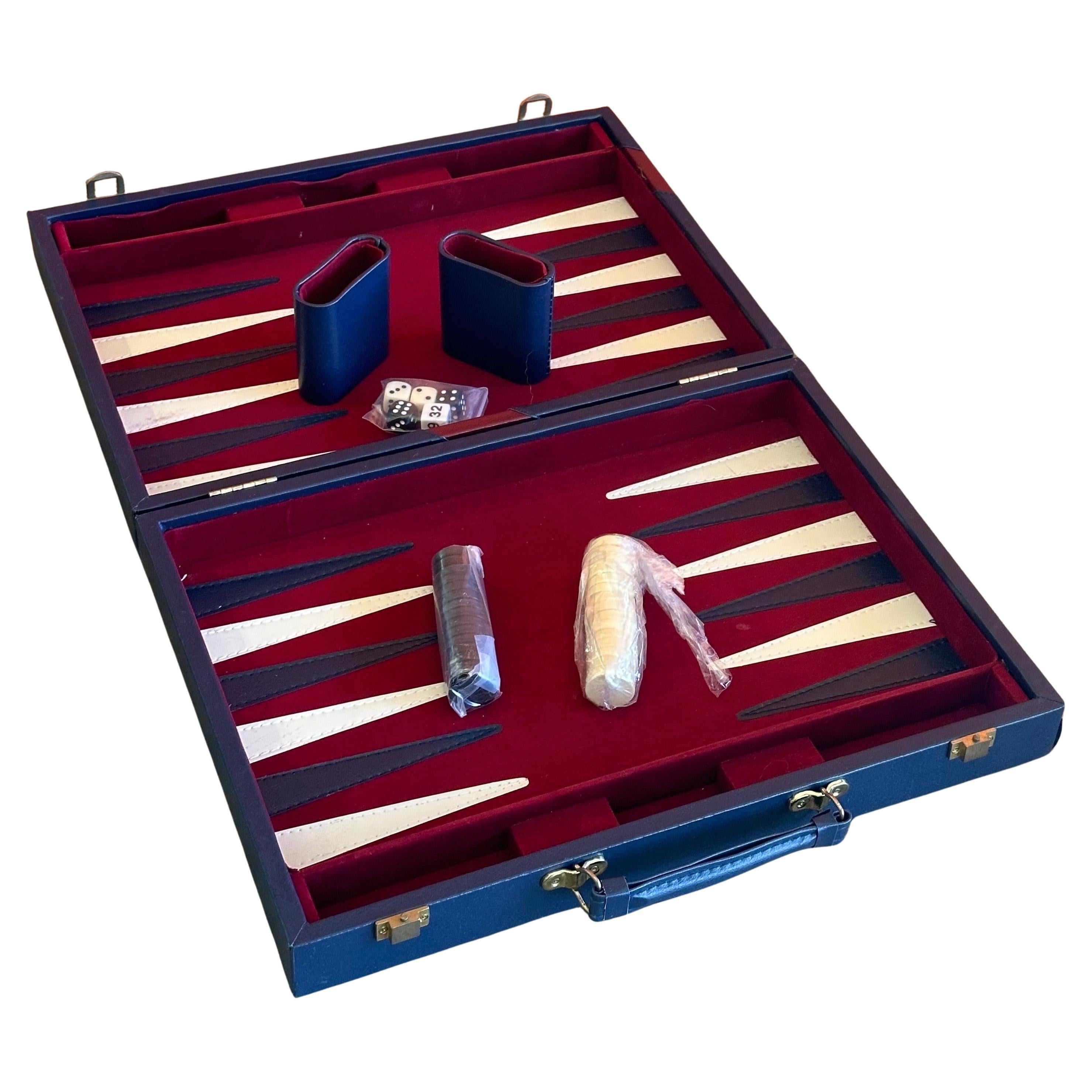 Vintage bakelite backgammon game set with dominoes, Mancala and Cribbage, circa 1970s. Set is in like new condition and appears to have never been used as components are still wrapped in plastic. The board measures 16