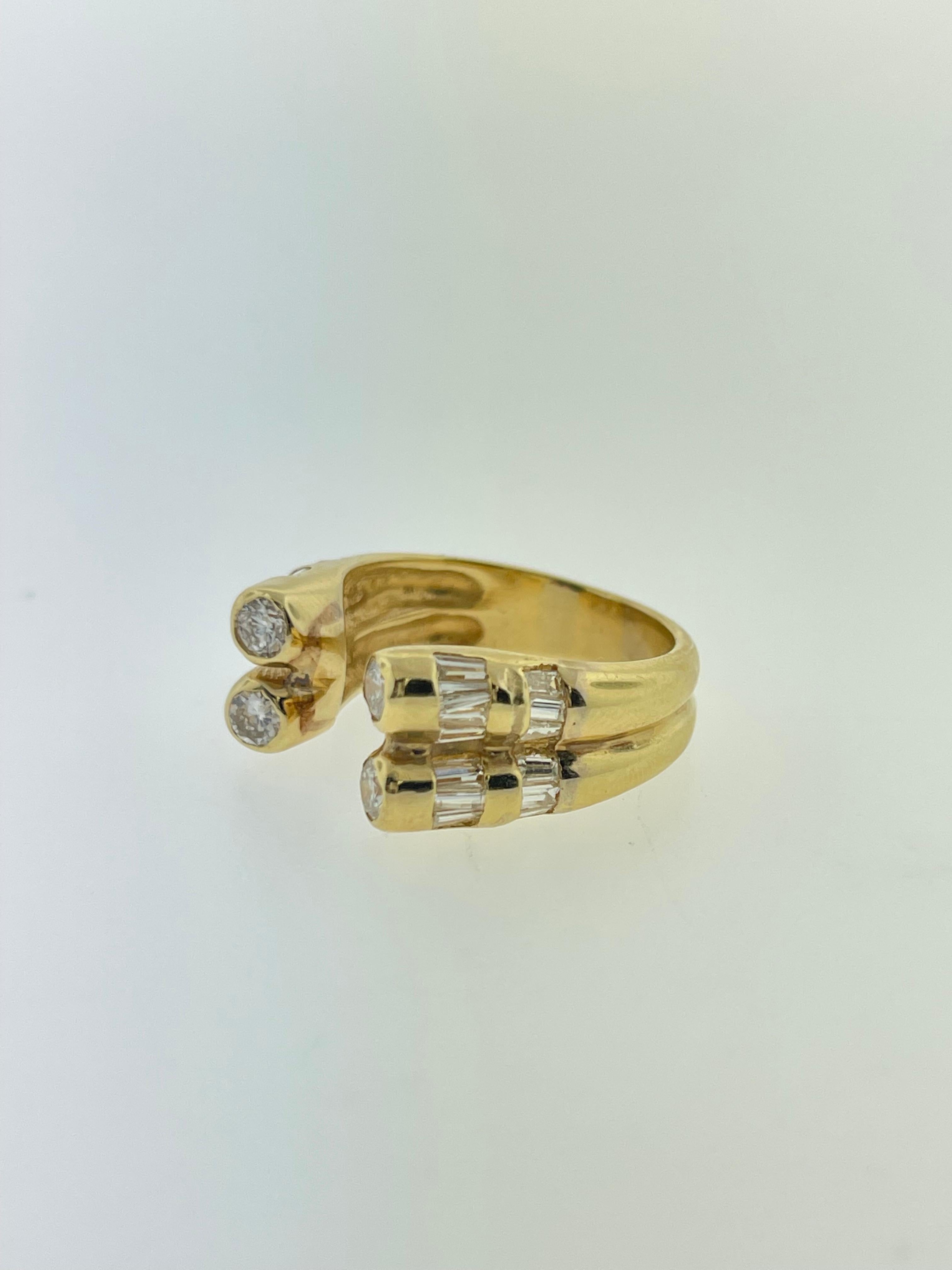 This vintage ring is set in 18K Yellow gold and with many beautiful, bright diamonds! With a mixture of round and baguette diamonds, this ring would look perfect on your finger! 