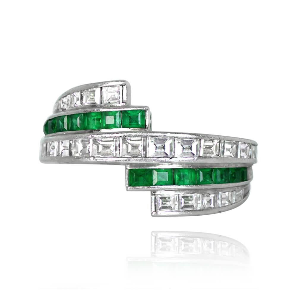 A vintage geometric ring showcasing alternated rows of channel-set baguette-cut diamonds and calibre natural emeralds. With a total diamond weight of 1.27 carats and a total emerald weight of 0.54 carats, this ring exudes elegance. Handcrafted in
