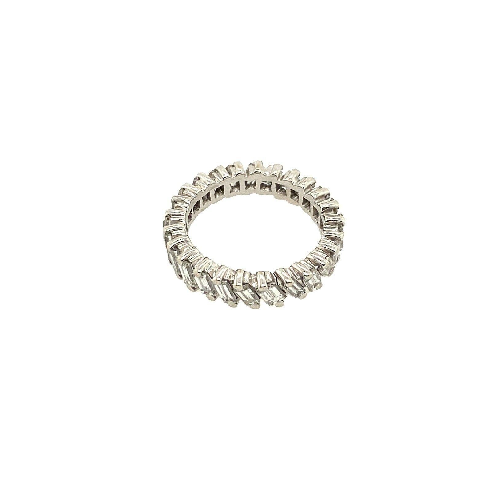 This vintage full eternity ring features 2.0ct of natural Baguette cut Diamonds in a stunning design, set in 18ct White Gold. 

Additional Information:
Total Diamond Weight: 2.0ct
Diamond Colour: H
Diamond Clarity: SI
Width of Band: 4.4mm
Width of