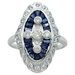 Anello vintage con zaffiro baguette e diamante rotondo a navetta in oro bianco 18 carati