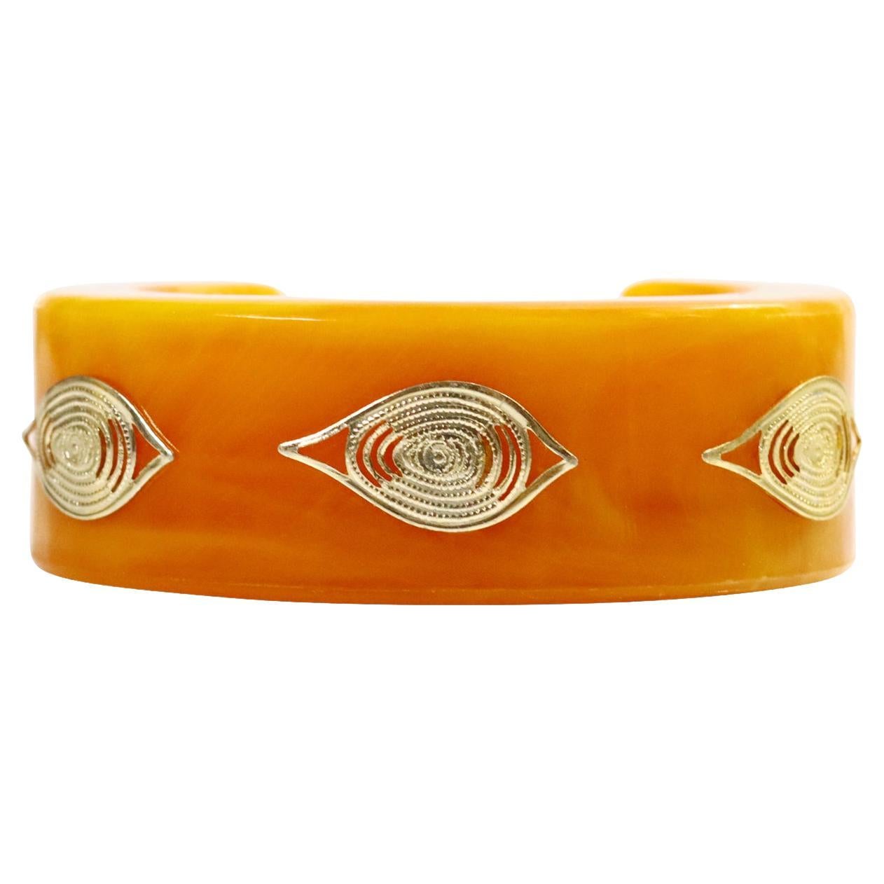 Manchette vintage en bakélite orange avec pièces en or en forme d'oeil maléfique en vente