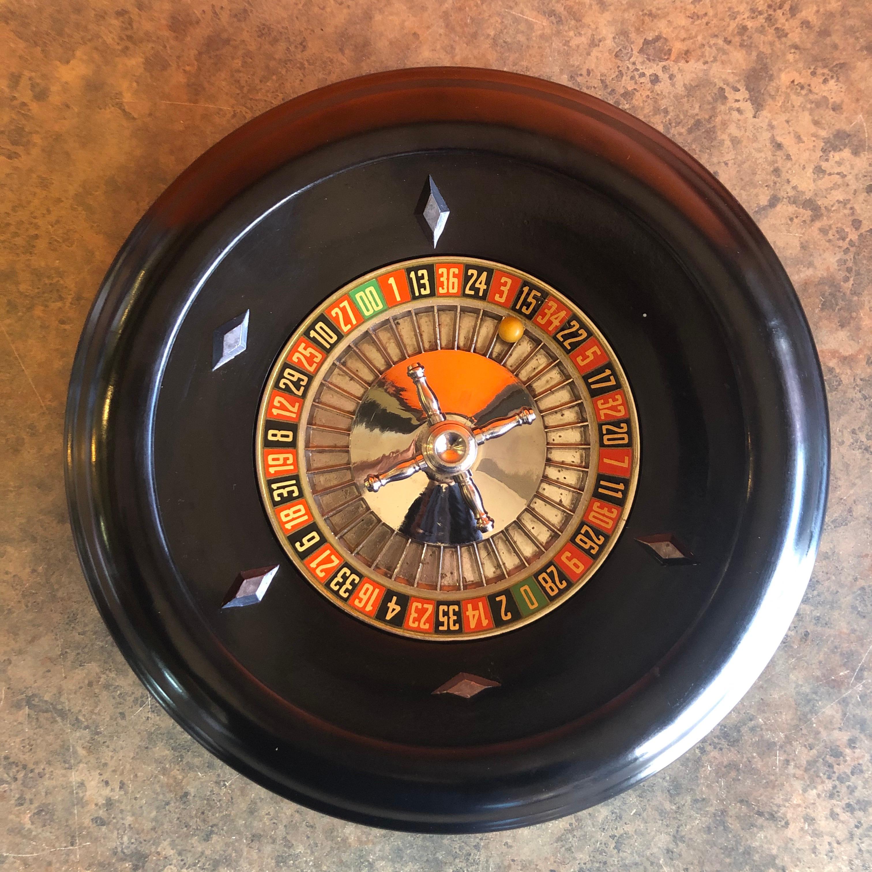 Vintage bakelite roulette wheel by Rottgames, circa 1940s. The wheel is 12