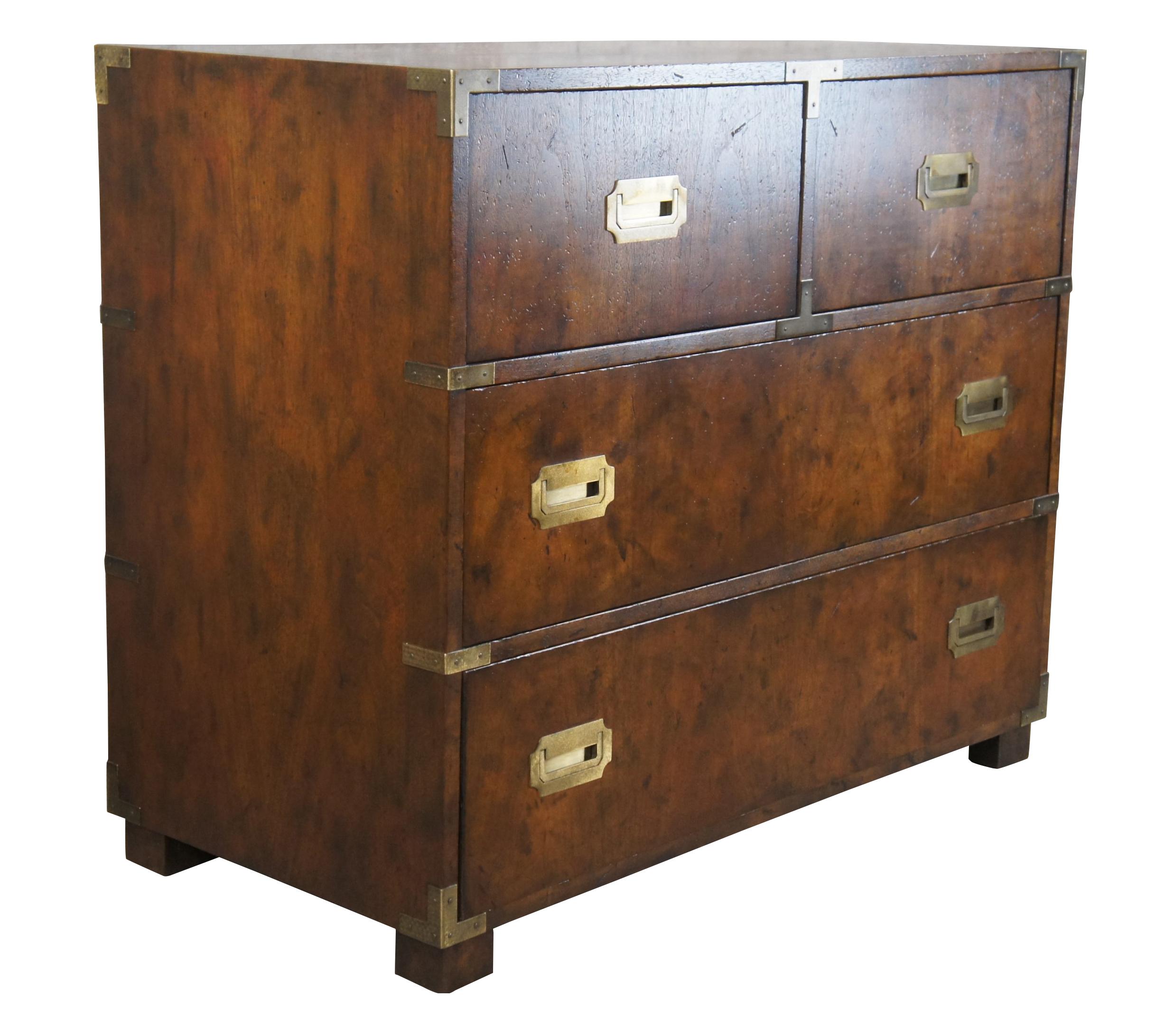 A stunning Anglo Indian style Campaign Dresser or Chest of Drawers by Baker Furniture, circa 1960s. Part of the Far East Collection. Made from European Walnut with a naturally distressed two over two drawer form. The dresser is accented by brass