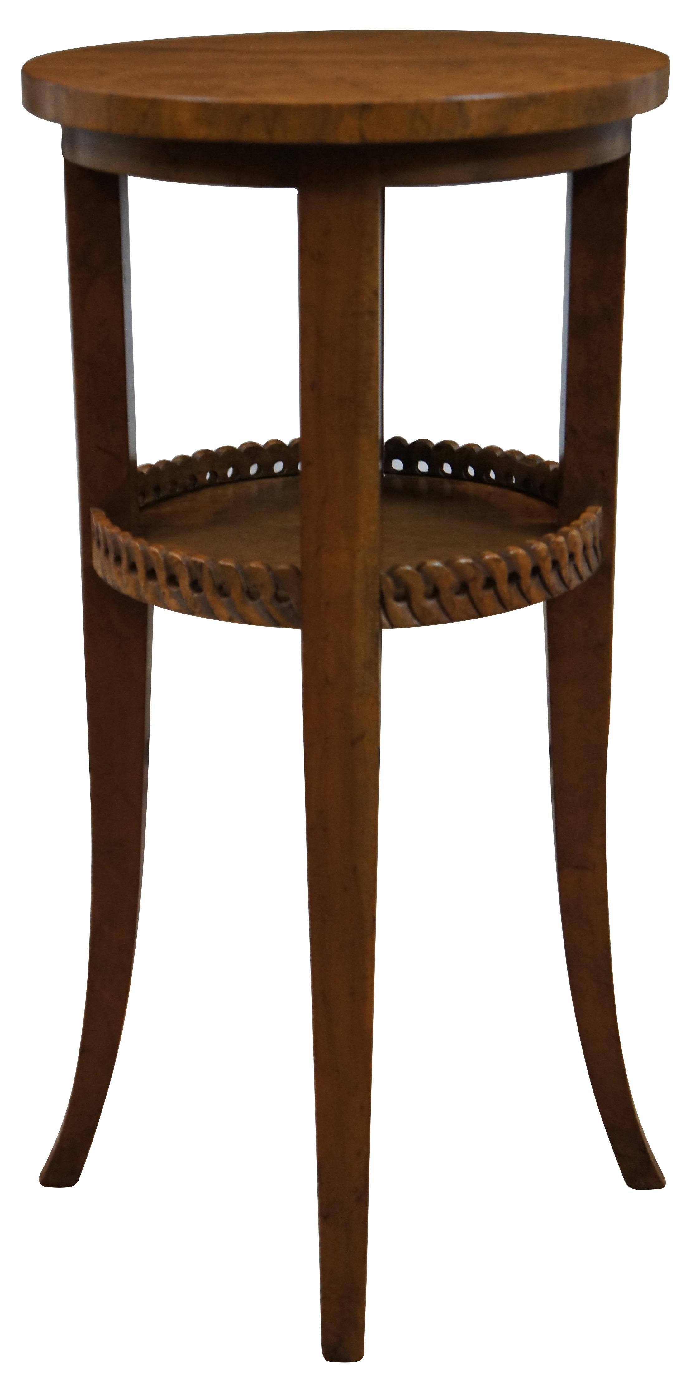 Rare Vintage Baker Furniture two tier accent table / plant stand with round top, sabre legs and a pierced rope twist gallery on the lower tier. Made from European Walnut. 

Style No: 3966 (Stand)
Literature : Page 88 of Baker's European and Far