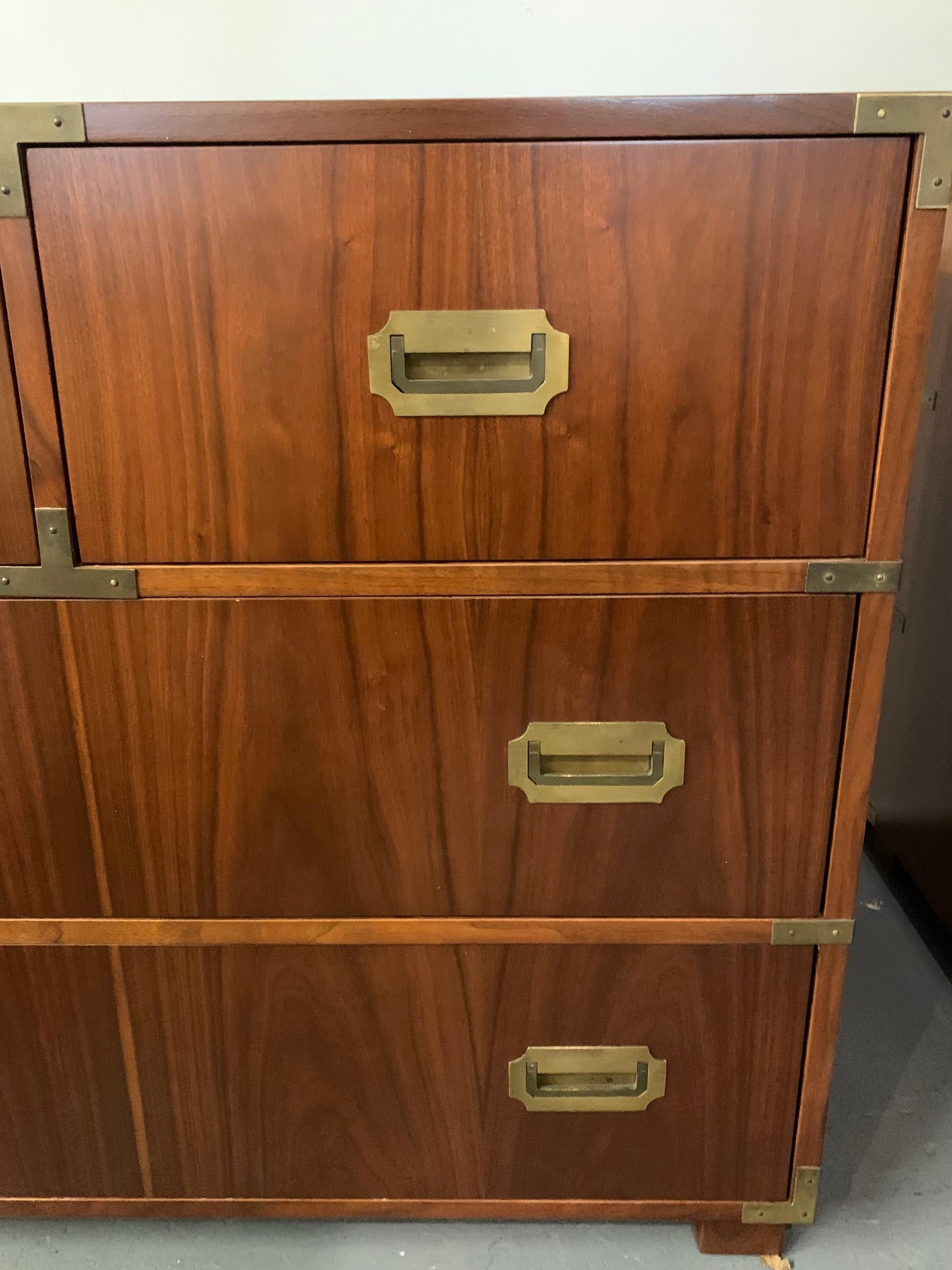 Handsome campaign style chest with four drawers and brass hardware and pulls. Baker medallion inside drawer. Note we also have the larger companion piece also available exclusively on 1stDibs this week. Own the best.